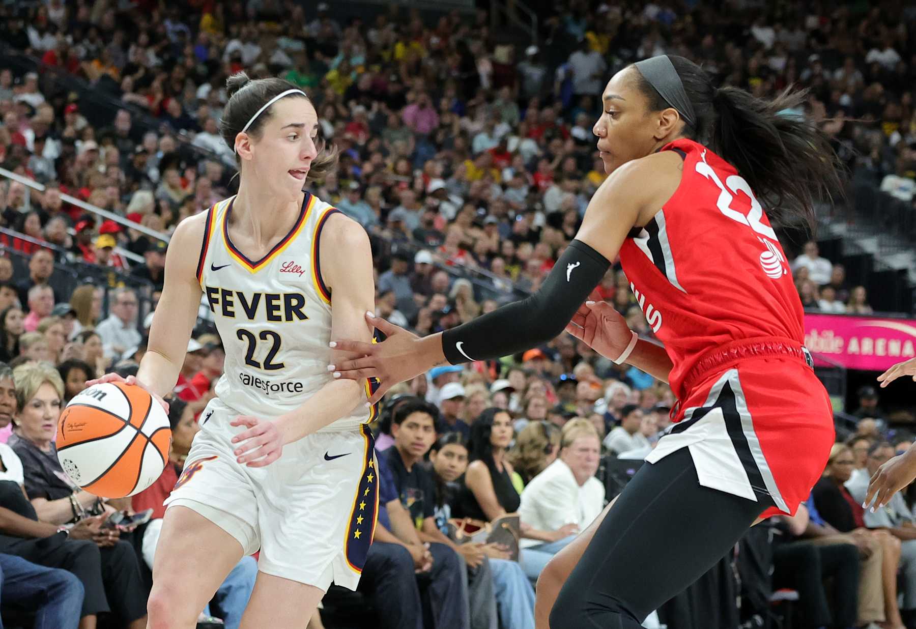 LAS VEGAS, NEVADA - JULY 02: Caitlin Clark #22 of the Indiana Fever is guarded by A'ja Wilson #22 of the Las Vegas Aces in the first quarter of their game at T-Mobile Arena on July 02, 2024 in Las Vegas, Nevada. The Aces defeated the Fever 88-69. NOTE TO USER: User expressly acknowledges and agrees that, by downloading and or using this photograph, User is consenting to the terms and conditions of the Getty Images License Agreement. (Photo by Ethan Miller/Getty Images)