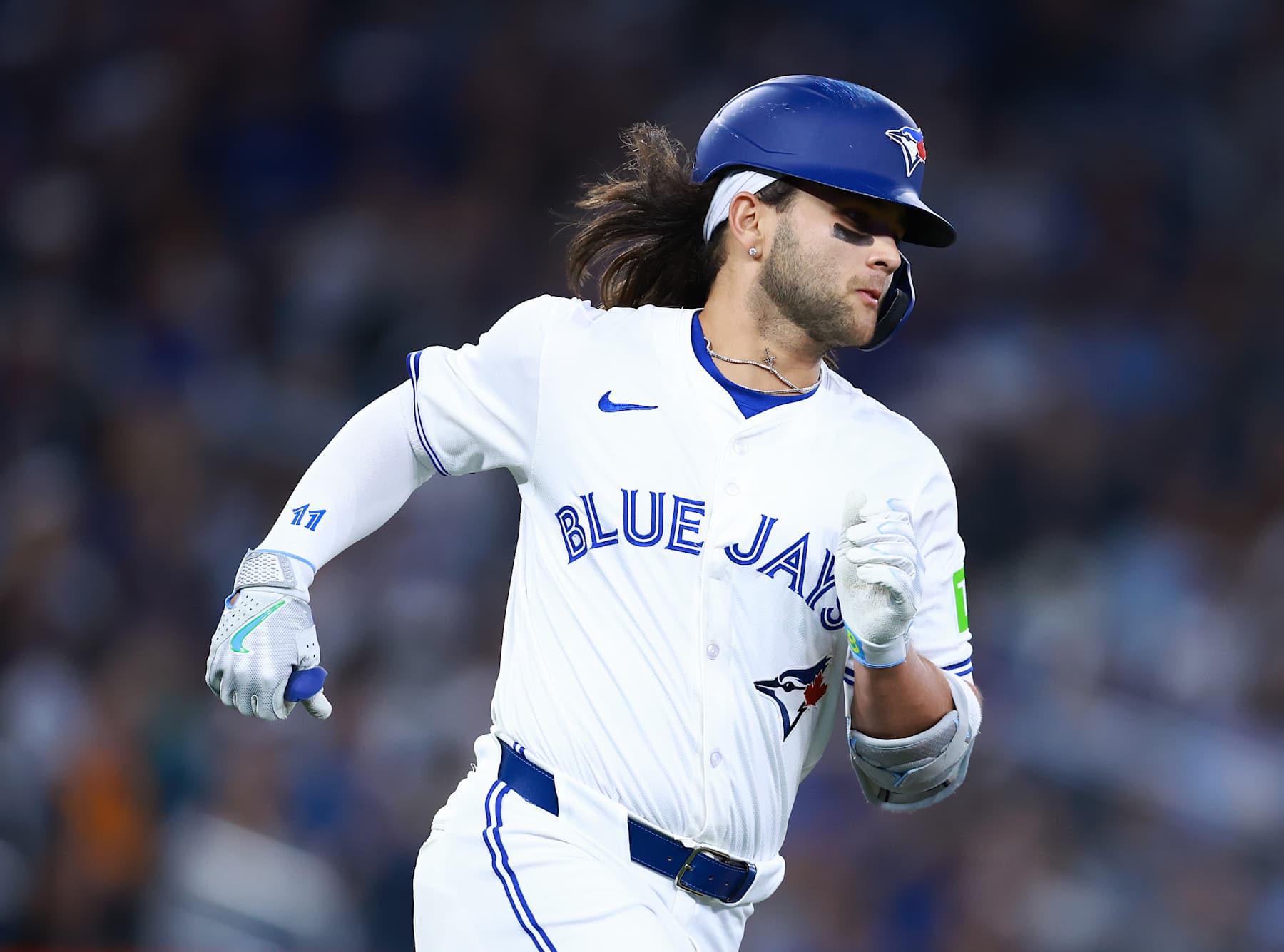 TORONTO, ON - MAY 10:  Bo Bichette #11 of the Toronto Blue Jays runs to first base during a game against the Minnesota Twins at Rogers Centre on May 10, 2024 in Toronto, Ontario, Canada.  (Photo by Vaughn Ridley/Getty Images)