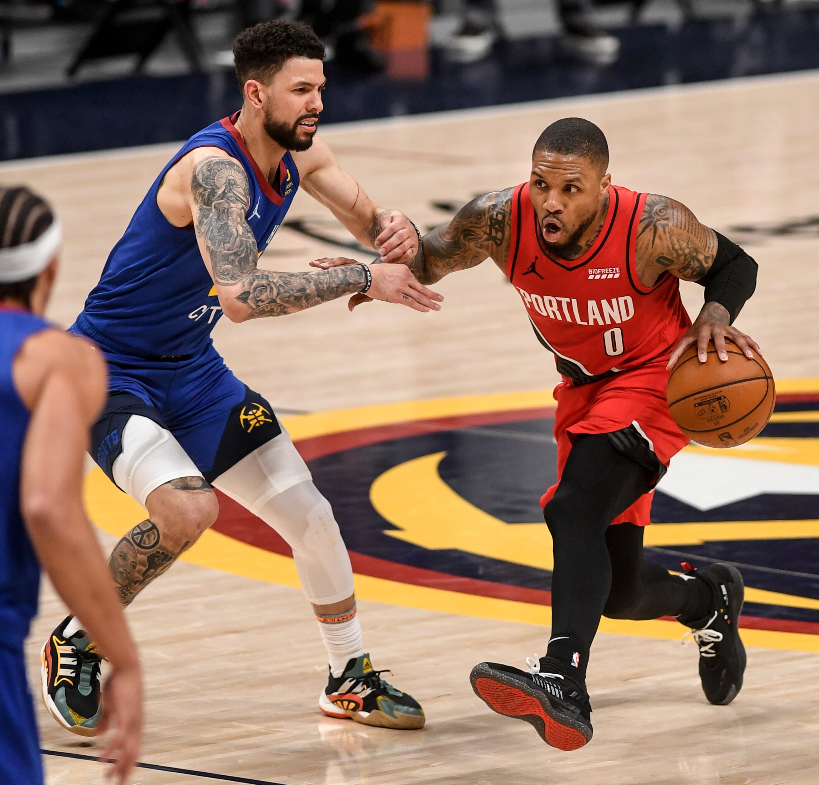 DENVER, CO - JUNE 1: Damian Lillard (0) of the Portland Trail Blazers cooks against Austin Rivers (25) of the Denver Nuggets during the first overtime period at Ball Arena on Tuesday, June 1, 2021. (Photo by AAron Ontiveroz/MediaNews Group/The Denver Post via Getty Images)