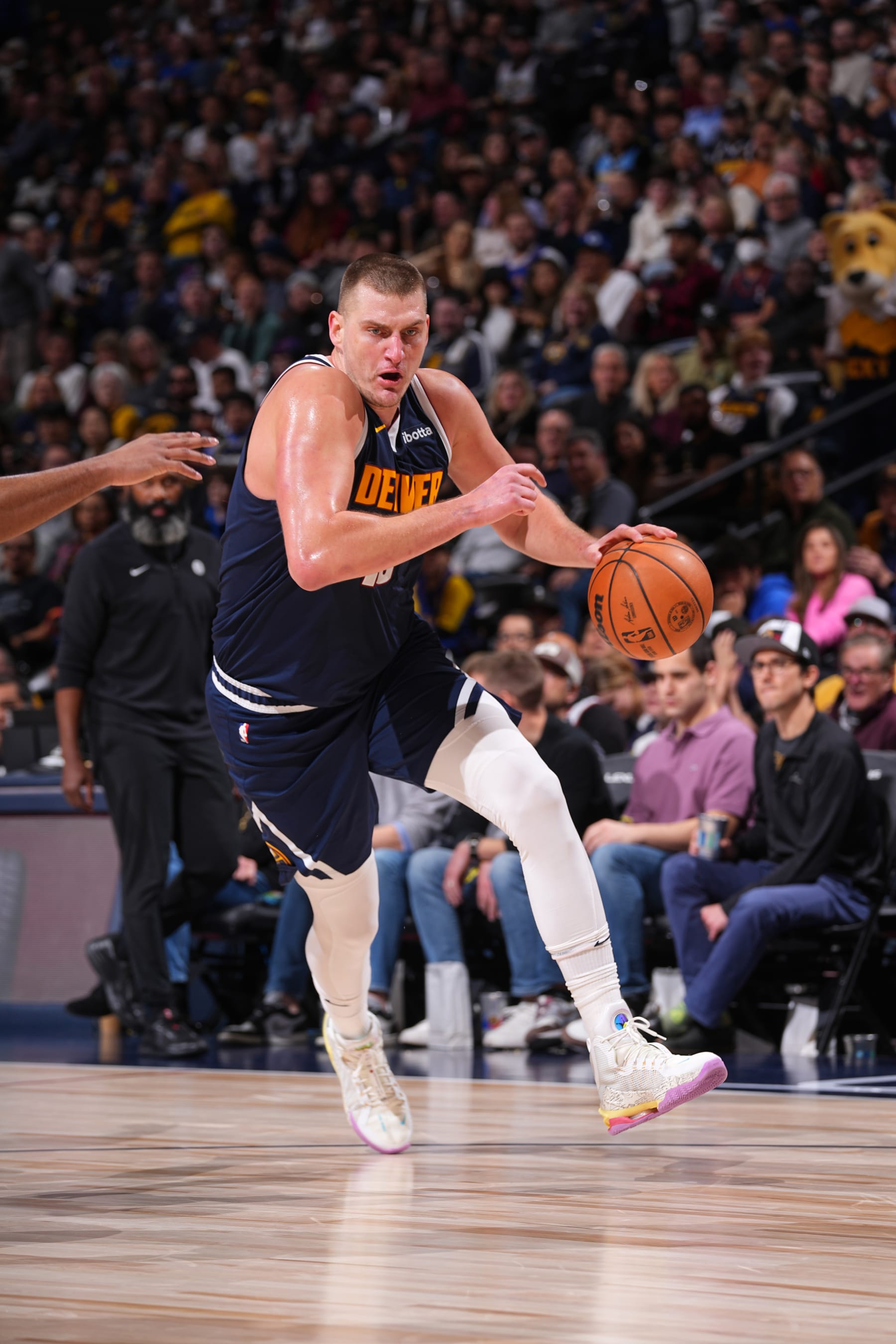 DENVER, CO - DECEMBER 14: Nikola Jokic #15 of the Denver Nuggets dribbles the ball during the game against the Brooklyn Nets on December 14, 2023 at the Ball Arena in Denver, Colorado. NOTE TO USER: User expressly acknowledges and agrees that, by downloading and/or using this Photograph, user is consenting to the terms and conditions of the Getty Images License Agreement. Mandatory Copyright Notice: Copyright 2023 NBAE (Photo by Bart Young/NBAE via Getty Images)