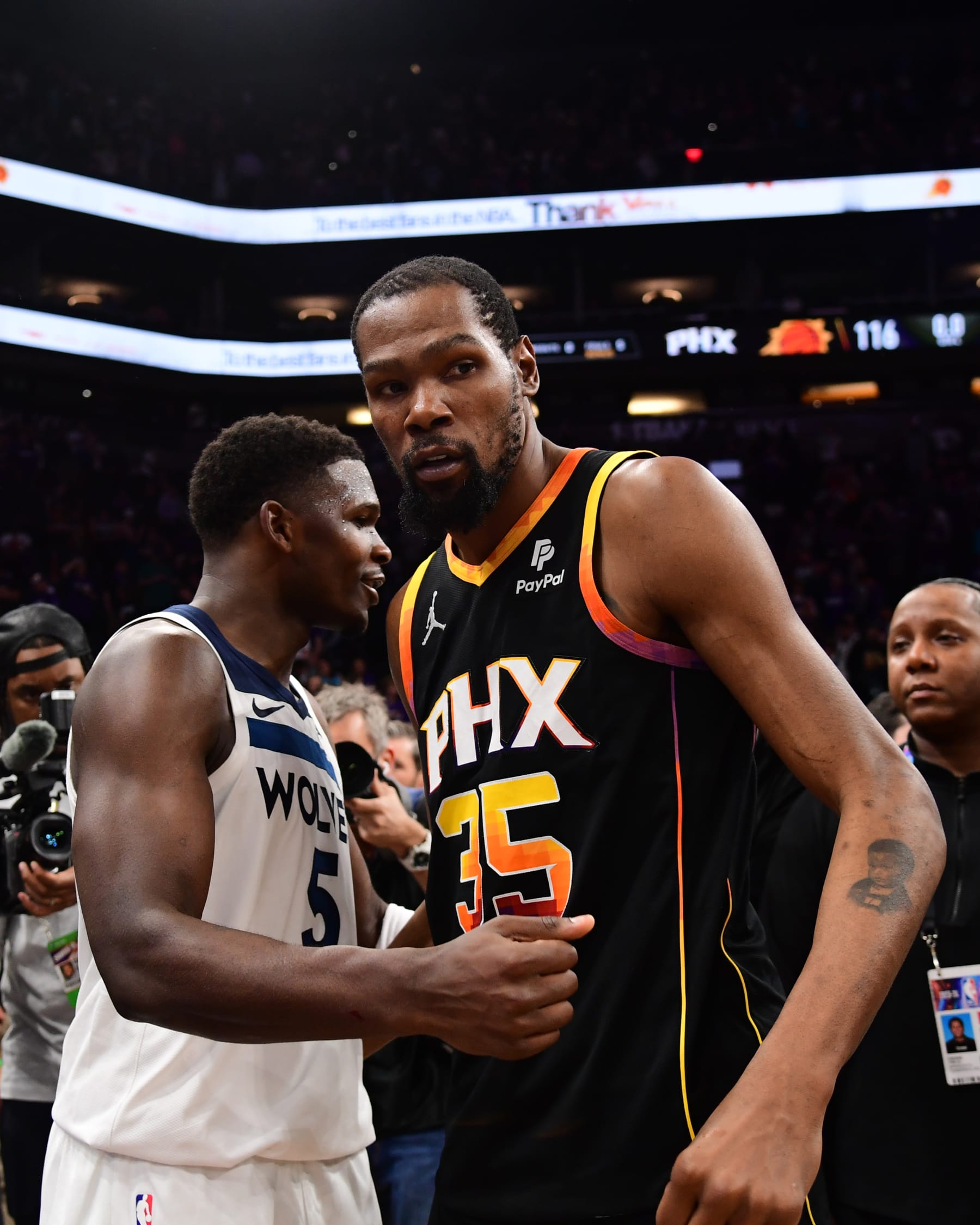 PHOENIX, AZ - APRIL  28: Anthony Edwards #5 of the Minnesota Timberwolves embraces Kevin Durant #35 of the Phoenix Suns after the game during Round 1 Game 4 of the 2024 NBA Playoffs on April 28, 2024 at Footprint Center in Phoenix, Arizona. NOTE TO USER: User expressly acknowledges and agrees that, by downloading and or using this photograph, user is consenting to the terms and conditions of the Getty Images License Agreement. Mandatory Copyright Notice: Copyright 2024 NBAE (Photo by Kate Frese/NBAE via Getty Images)