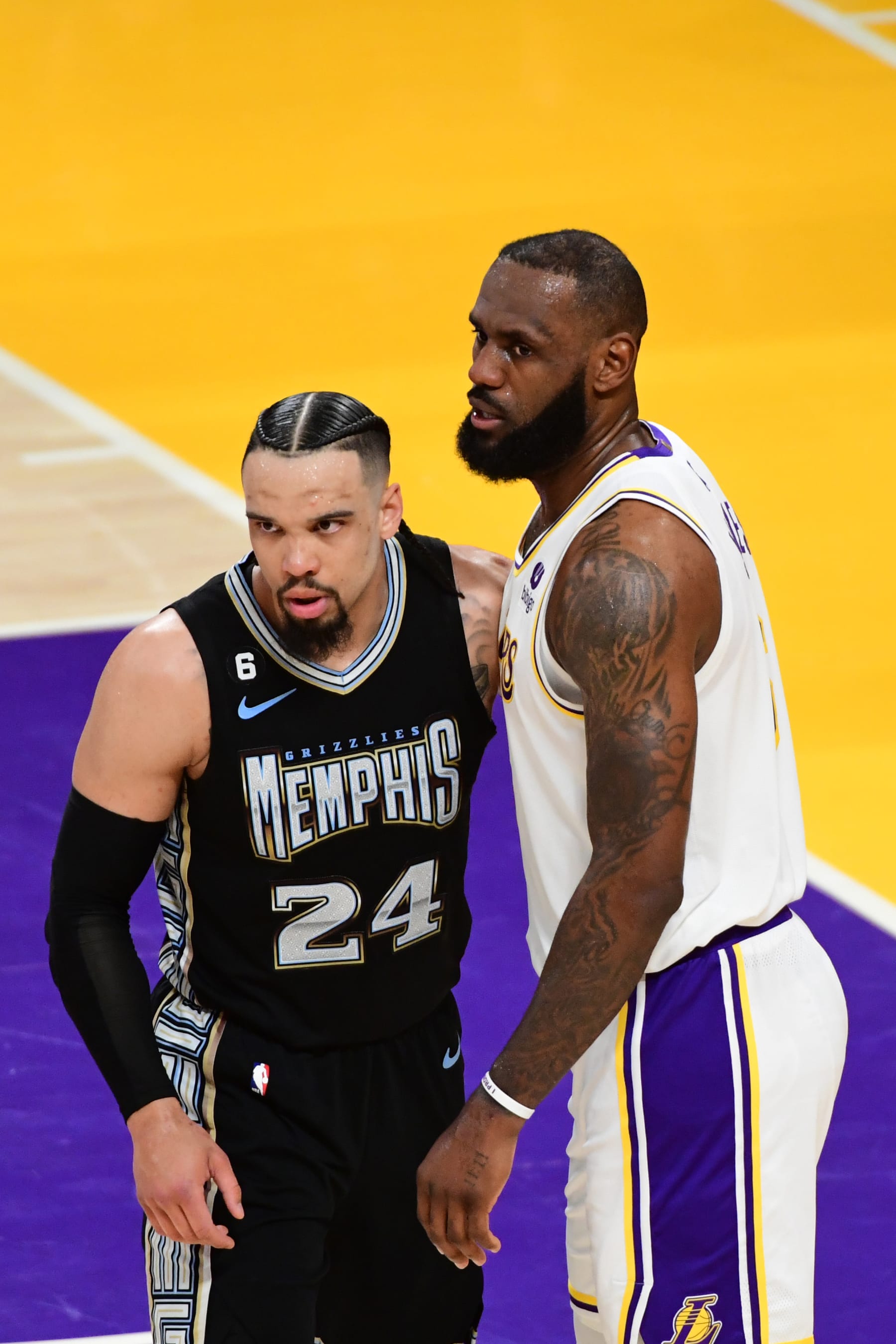LOS ANGELES, CA - APRIL 22: Dillon Brooks #24 of the Memphis Grizzlies and LeBron James #6 of the Los Angeles Lakers looks on during the game during Round One Game Three of the 2023 NBA Playoffs on April 22, 2023 at Crypto.Com Arena in Los Angeles, California. NOTE TO USER: User expressly acknowledges and agrees that, by downloading and/or using this Photograph, user is consenting to the terms and conditions of the Getty Images License Agreement. Mandatory Copyright Notice: Copyright 2023 NBAE (Photo by Adam Pantozzi/NBAE via Getty Images)