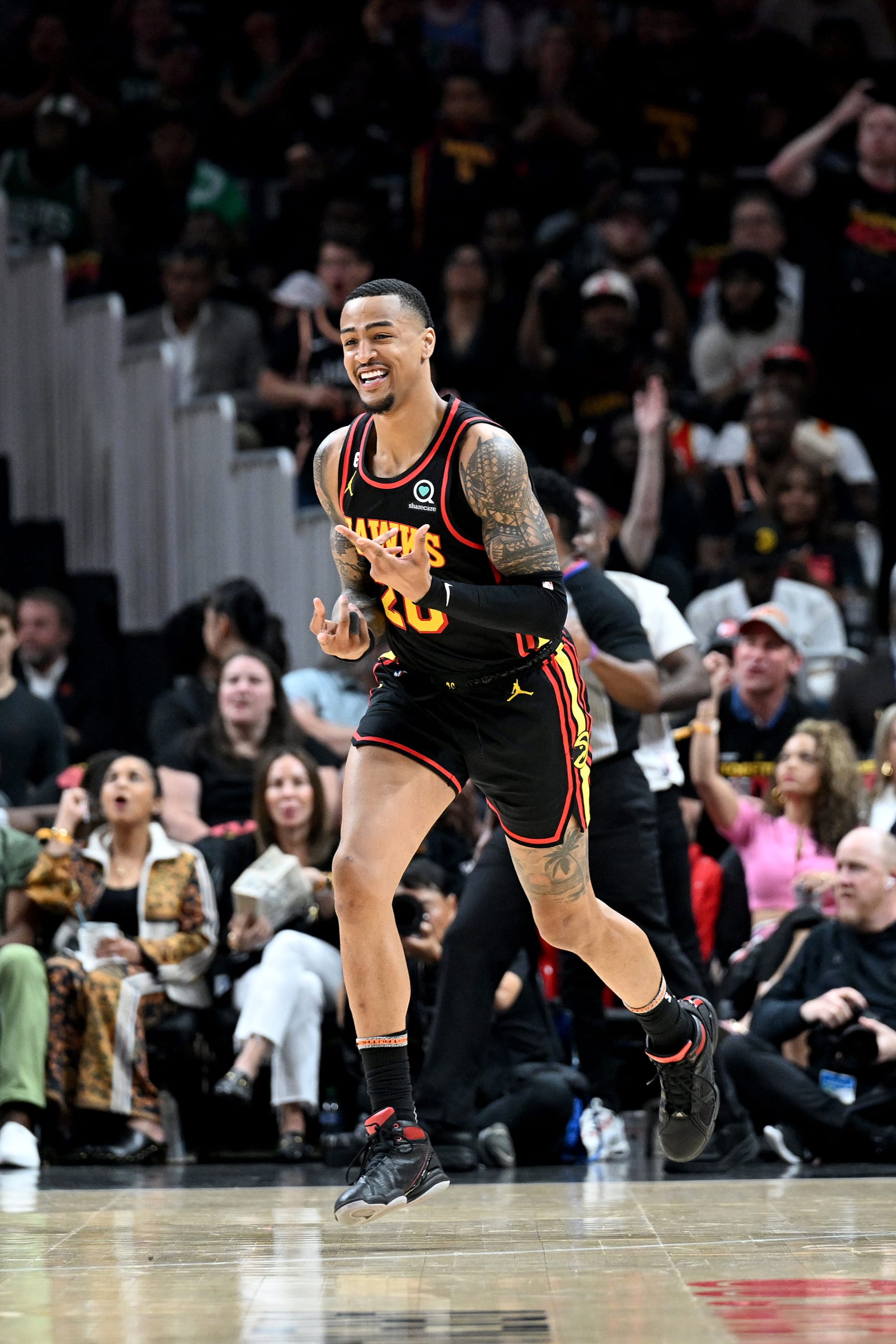 ATLANTA, GA - APRIL 21: John Collins #20 of the Atlanta Hawks smiles during the game against the Boston Celtics during round one game three of the 2023 NBA Playoffs on April 21, 2023 at State Farm Arena in Atlanta, Georgia.  NOTE TO USER: User expressly acknowledges and agrees that, by downloading and/or using this Photograph, user is consenting to the terms and conditions of the Getty Images License Agreement. Mandatory Copyright Notice: Copyright 2023 NBAE (Photo by Adam Hagy/NBAE via Getty Images)