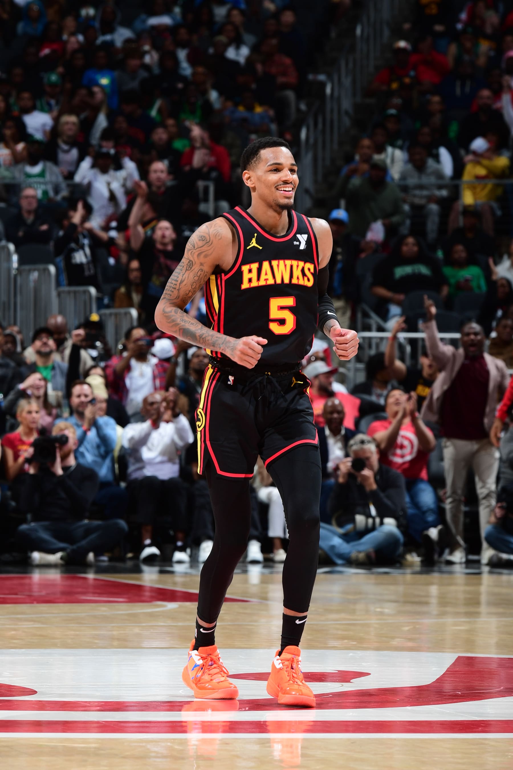 ATLANTA, GA - MARCH 28: Dejounte Murray #5 of the Atlanta Hawks smiles during the game against the Boston Celtics on March 28, 2024 at State Farm Arena in Atlanta, Georgia.  NOTE TO USER: User expressly acknowledges and agrees that, by downloading and/or using this Photograph, user is consenting to the terms and conditions of the Getty Images License Agreement. Mandatory Copyright Notice: Copyright 2024 NBAE (Photo by Scott Cunningham/NBAE via Getty Images)