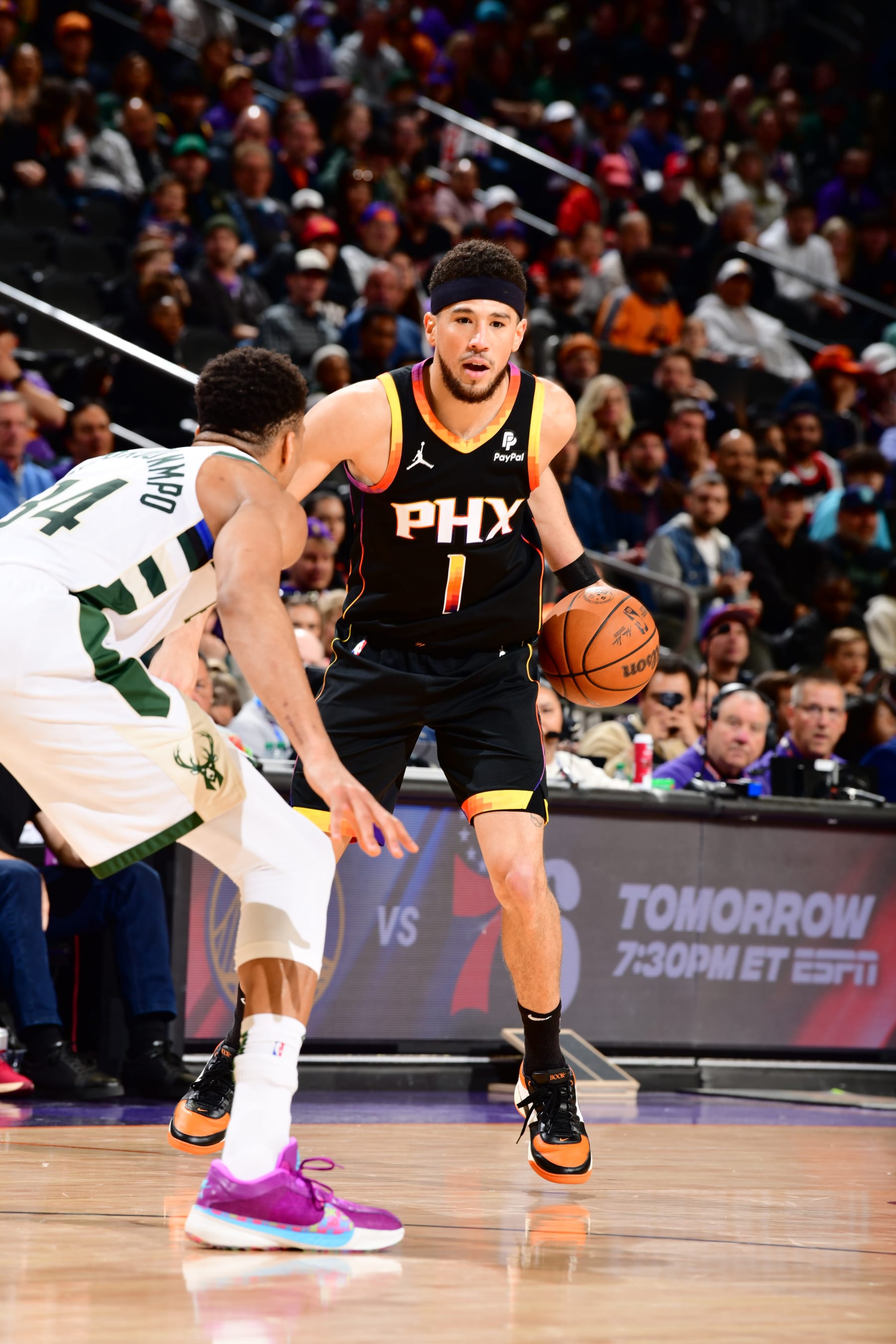 PHOENIX, AZ - FEBRUARY 6:  Devin Booker #1 of the Phoenix Suns handles the ball during the game  on February 6, 2024 at Footprint Center in Phoenix, Arizona. NOTE TO USER: User expressly acknowledges and agrees that, by downloading and or using this photograph, user is consenting to the terms and conditions of the Getty Images License Agreement. Mandatory Copyright Notice: Copyright 2024 NBAE (Photo by Barry Gossage/NBAE via Getty Images)