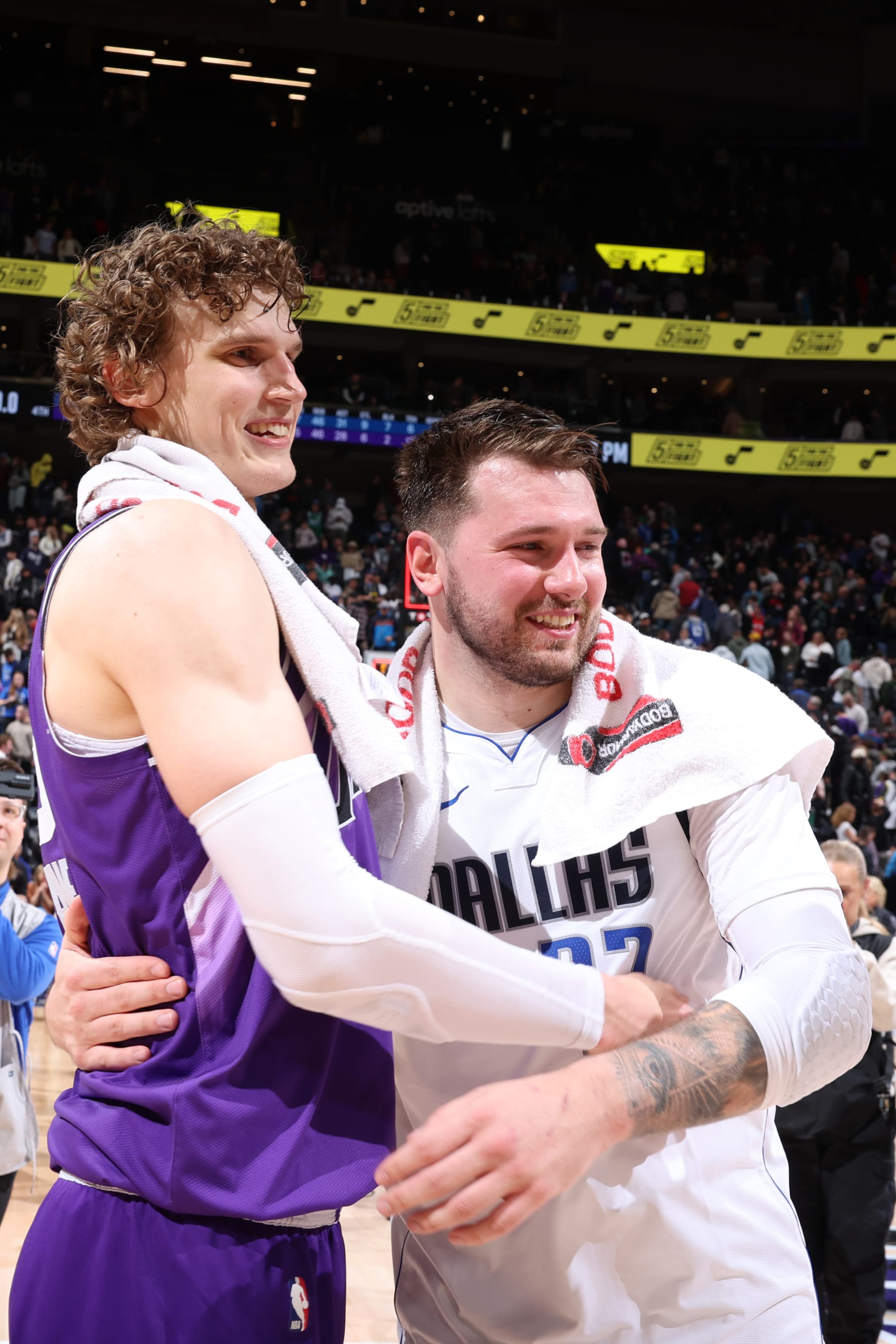 SALT LAKE CITY, UT - MARCH 25: Lauri Markkanen #23 of the Utah Jazz hugs Luka Doncic #77 of the Dallas Mavericks after the game on March 25, 2024 at Delta Center in Salt Lake City, Utah. NOTE TO USER: User expressly acknowledges and agrees that, by downloading and or using this Photograph, User is consenting to the terms and conditions of the Getty Images License Agreement. Mandatory Copyright Notice: Copyright 2024 NBAE (Photo by Melissa Majchrzak/NBAE via Getty Images)