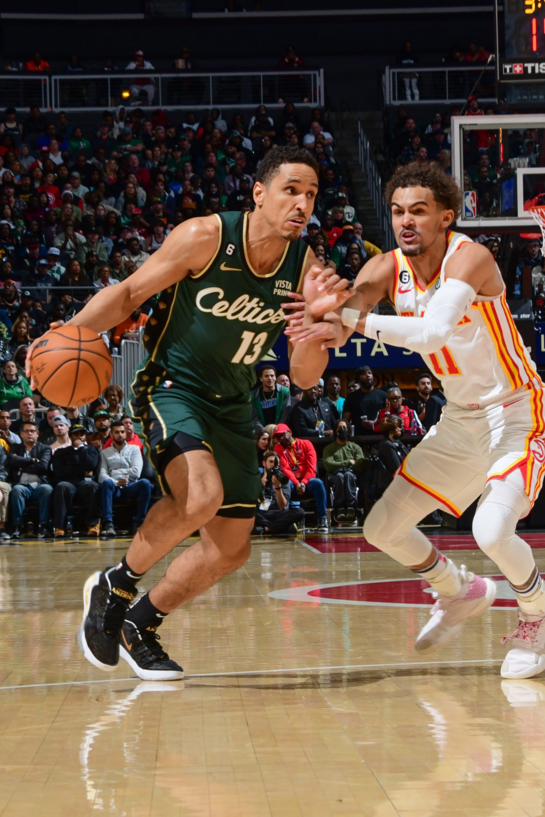 ATLANTA, GA - MARCH 11: Malcolm Brogdon #13 of the Boston Celtics goes to the basket during the game on March 11, 2023 at State Farm Arena in Atlanta, Georgia.  NOTE TO USER: User expressly acknowledges and agrees that, by downloading and/or using this Photograph, user is consenting to the terms and conditions of the Getty Images License Agreement. Mandatory Copyright Notice: Copyright 2023 NBAE (Photo by Scott Cunningham/NBAE via Getty Images)