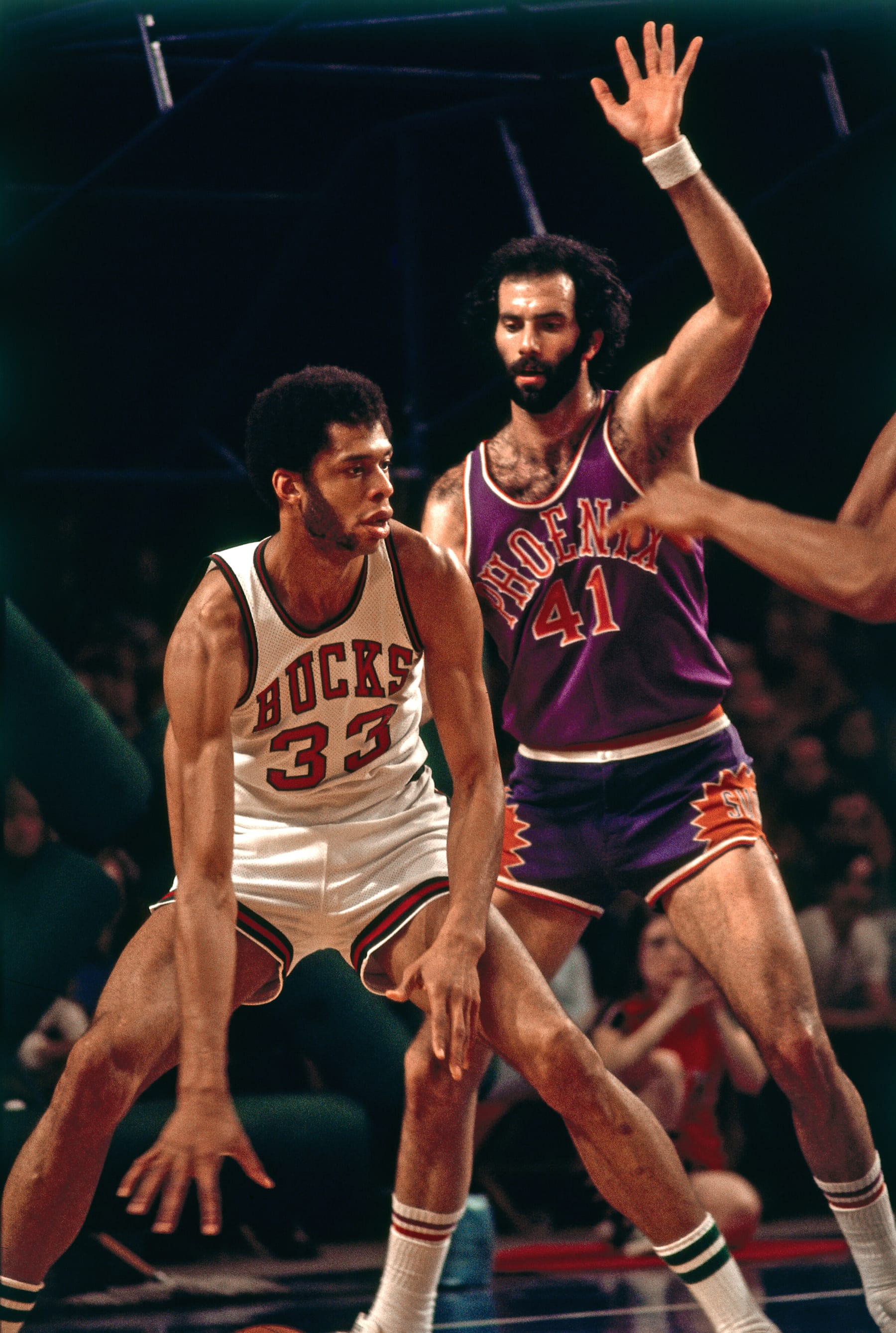 MILWAUKEE, WI - MARCH 11: Kareem Abdul-Jabbar #33 of the Milwaukee Bucks handles the ball against Neal Walk #41 of the Phoenix Suns on March 11, 1974 at the MECCA Arena in Milwaukee, Wisconsin. NOTE TO USER: User expressly acknowledges and agrees that, by downloading and/or using this photograph, user is consenting to the terms and conditions of the Getty Images License Agreement. Mandatory Copyright Notice: Copyright 1974 NBAE (Photo by Vernon Biever/NBAE via Getty Images)