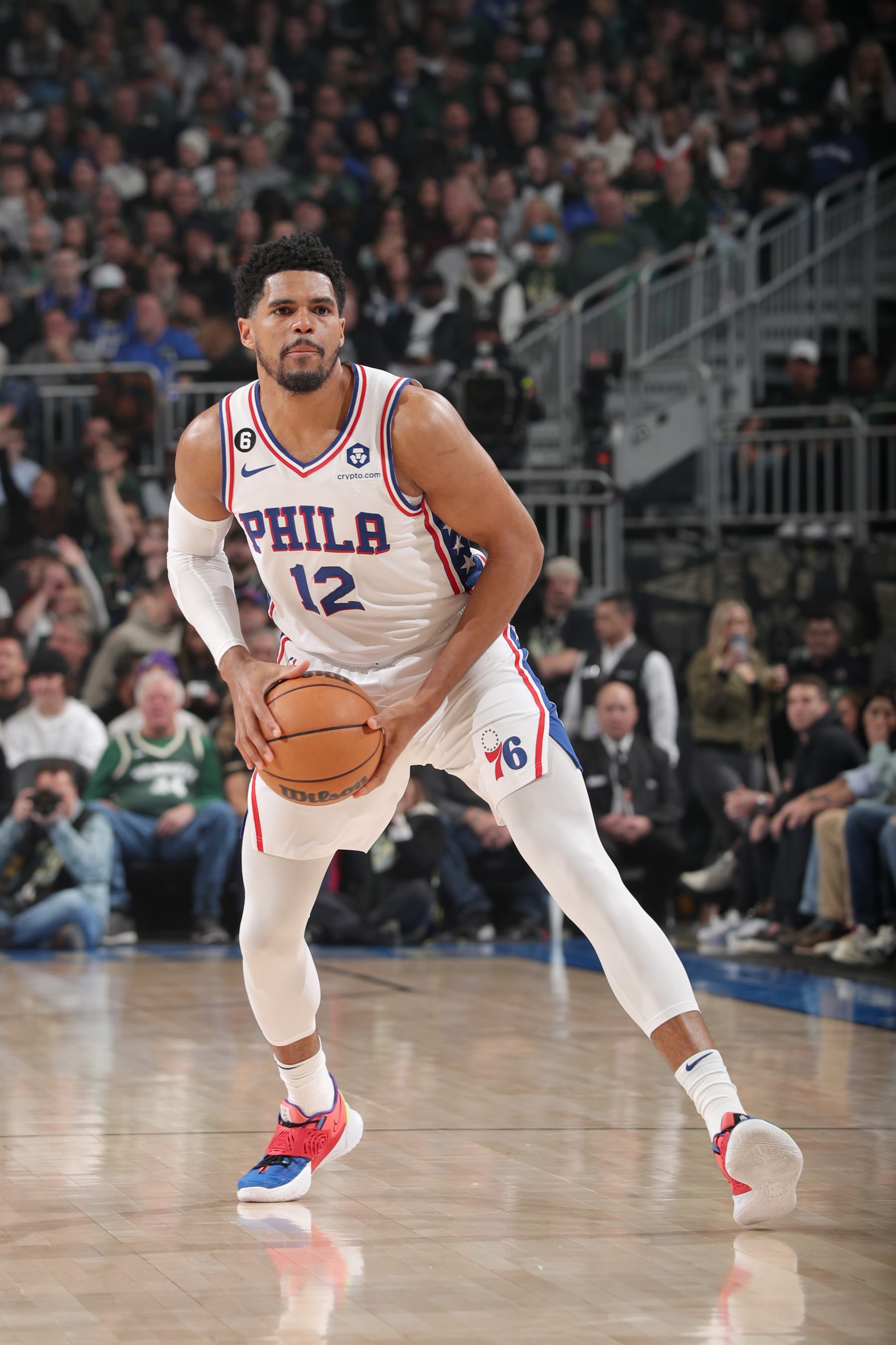 MILWAUKEE, WI - MARCH 4: Tobias Harris #12 of the Philadelphia 76ers looks to pass the ball during the game against the Milwaukee Bucks on March 4, 2023 at the Fiserv Forum Center in Milwaukee, Wisconsin. NOTE TO USER: User expressly acknowledges and agrees that, by downloading and or using this Photograph, user is consenting to the terms and conditions of the Getty Images License Agreement. Mandatory Copyright Notice: Copyright 2023 NBAE (Photo by Gary Dineen/NBAE via Getty Images).