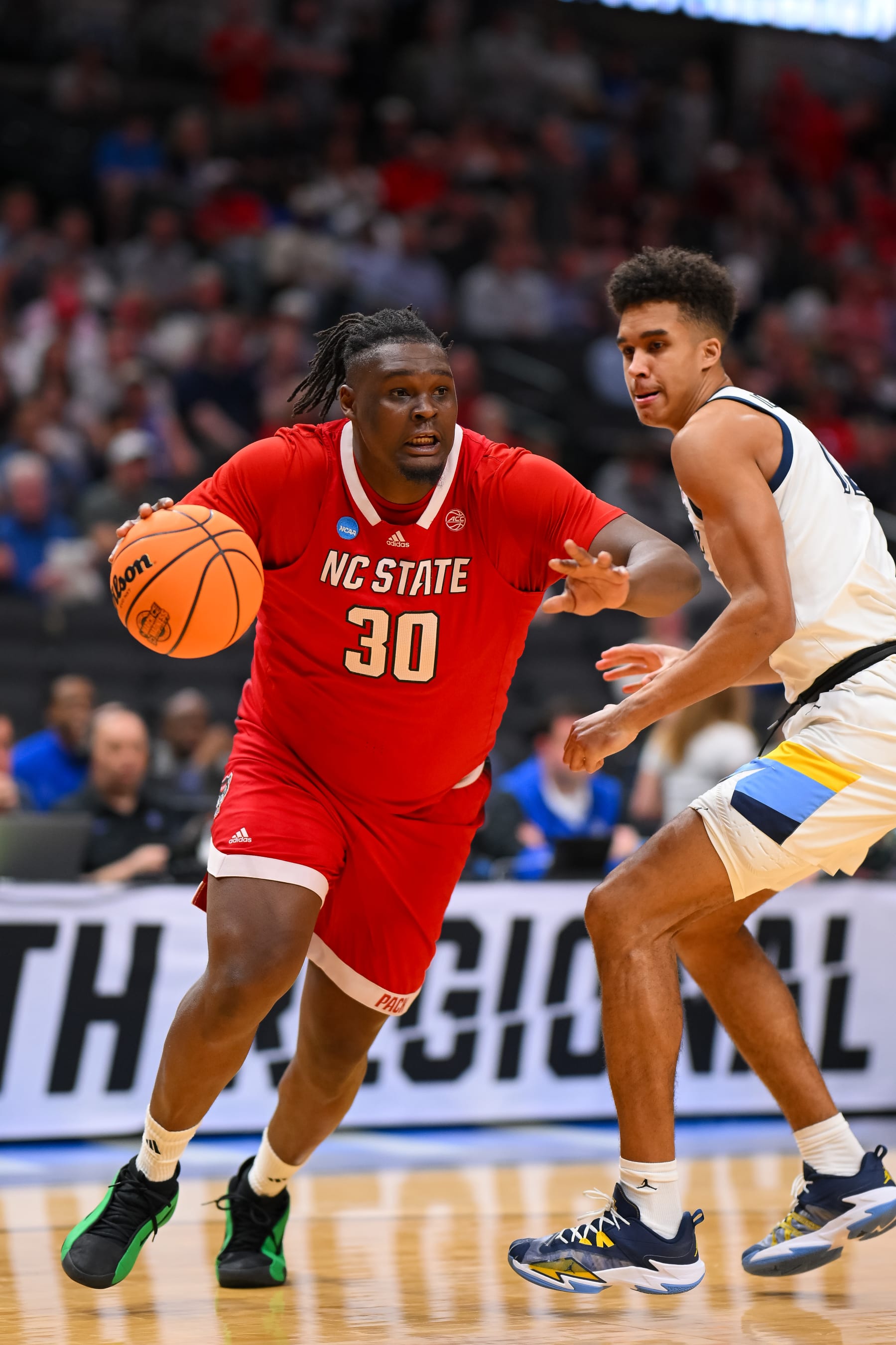 DALLAS, TEXAS - MARCH 29: DJ Burns Jr. #30 of the North Carolina State Wolfpack drives baseline during the Sweet Sixteen round of the 2024 NCAA Men's Basketball Tournament held at American Airlines Center on March 29, 2024 in Dallas, Texas. (Photo by Andy Hancock/NCAA Photos/NCAA Photos via Getty Images)