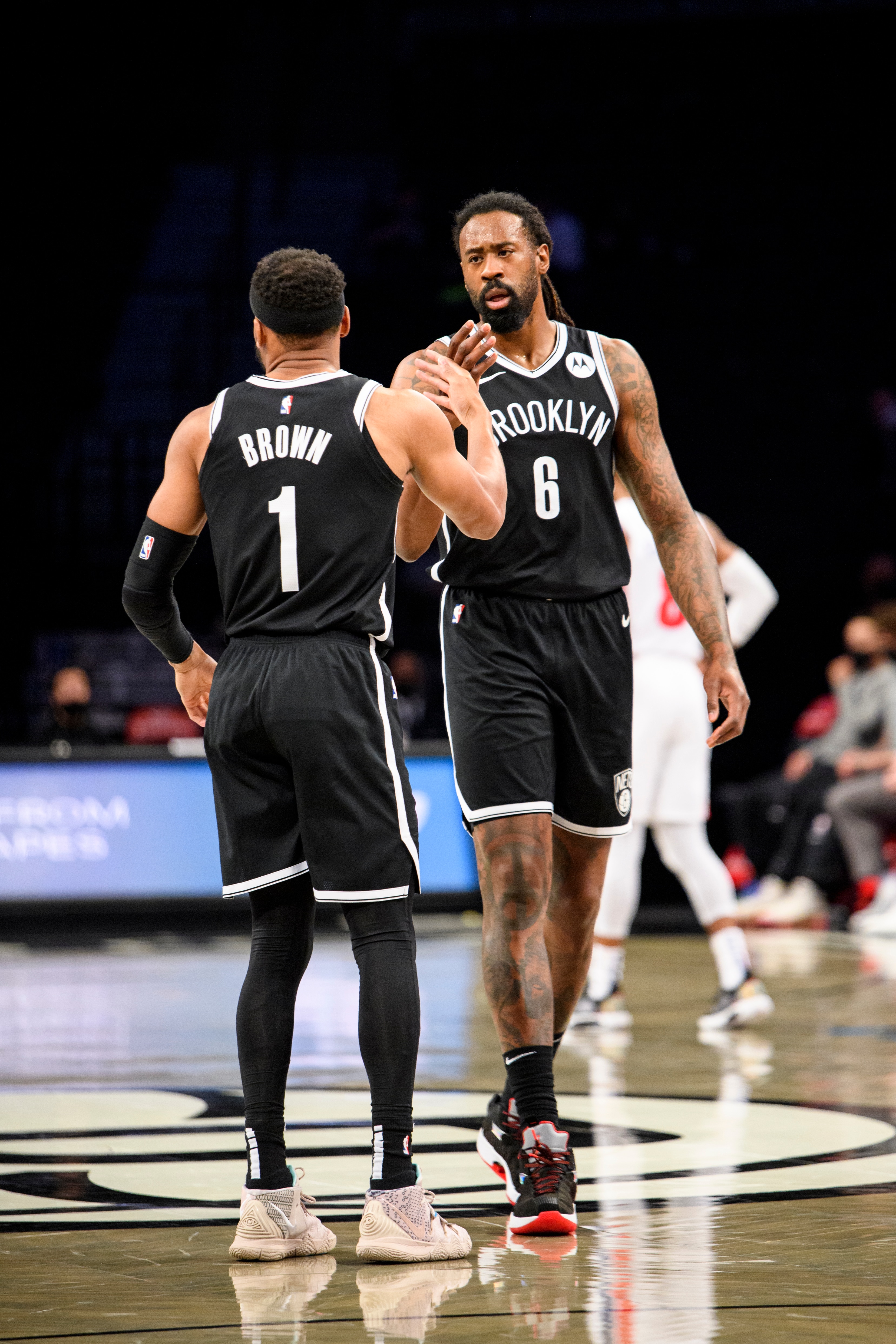 BROOKLYN, NY - MARCH 13 : DeAndre Jordan #6 high fives Bruce Brown #1 of the Brooklyn Nets during the game against the Detroit Pistons on March 13, 2021 at Barclays Center in Brooklyn, New York. NOTE TO USER: User expressly acknowledges and agrees that, by downloading and or using this Photograph, user is consenting to the terms and conditions of the Getty Images License Agreement. Mandatory Copyright Notice: Copyright 2021 NBAE (Photo by David L. Nemec/NBAE via Getty Images)
