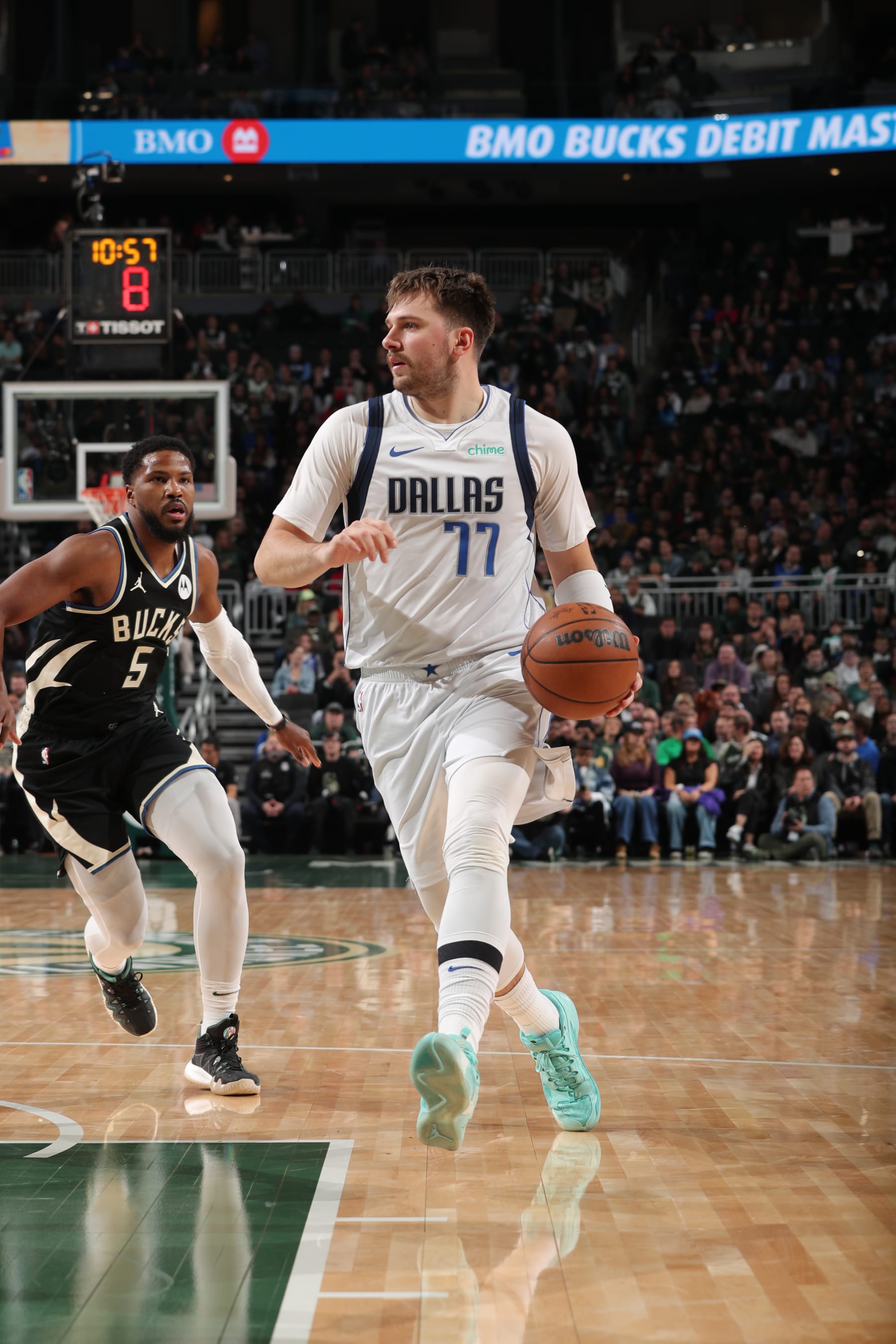 MILWAUKEE, WI - NOVEMBER 18: Luka Doncic #77 of the Dallas Mavericks dribbles the ball during the game against the Milwaukee Bucks on November 18, 2023 at the Fiserv Forum Center in Milwaukee, Wisconsin. NOTE TO USER: User expressly acknowledges and agrees that, by downloading and or using this Photograph, user is consenting to the terms and conditions of the Getty Images License Agreement. Mandatory Copyright Notice: Copyright 2023 NBAE (Photo by Gary Dineen/NBAE via Getty Images).