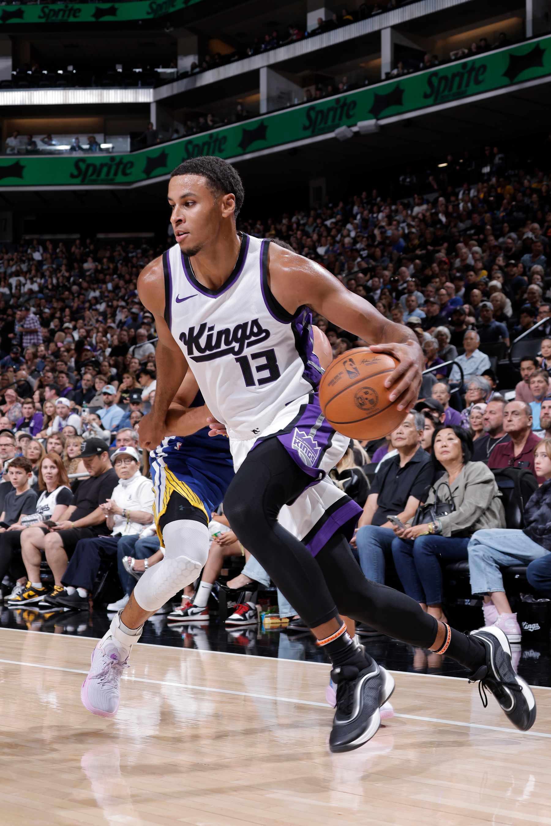 SACRAMENTO, CA - OCTOBER 9: Keegan Murray #13 of the Sacramento Kings dribbles the ball during the game against the Golden State Warriors during a NBA preseason game on October 9, 2024 at Golden 1 Center in Sacramento, California. NOTE TO USER: User expressly acknowledges and agrees that, by downloading and or using this Photograph, user is consenting to the terms and conditions of the Getty Images License Agreement. Mandatory Copyright Notice: Copyright 2024 NBAE (Photo by Rocky Widner/NBAE via Getty Images)