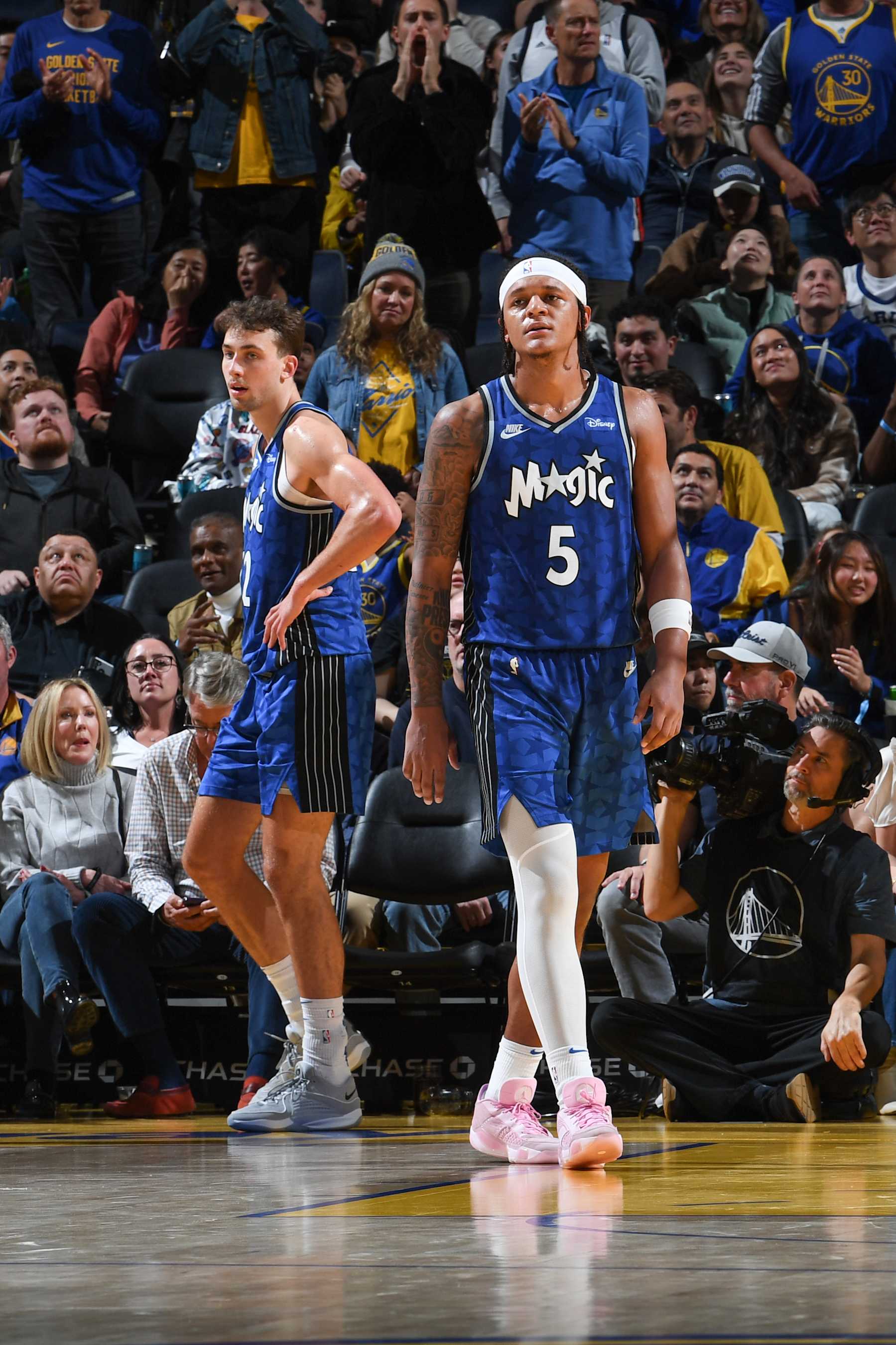SAN FRANCISCO, CA - JANUARY 2:  Paolo Banchero #5 of the Orlando Magic & Franz Wagner #22 of the Orlando Magic looks on during the game on January 2, 2024 at Chase Center in San Francisco, California. NOTE TO USER: User expressly acknowledges and agrees that, by downloading and or using this photograph, user is consenting to the terms and conditions of Getty Images License Agreement. Mandatory Copyright Notice: Copyright 2024 NBAE (Photo by Noah Graham/NBAE via Getty Images)