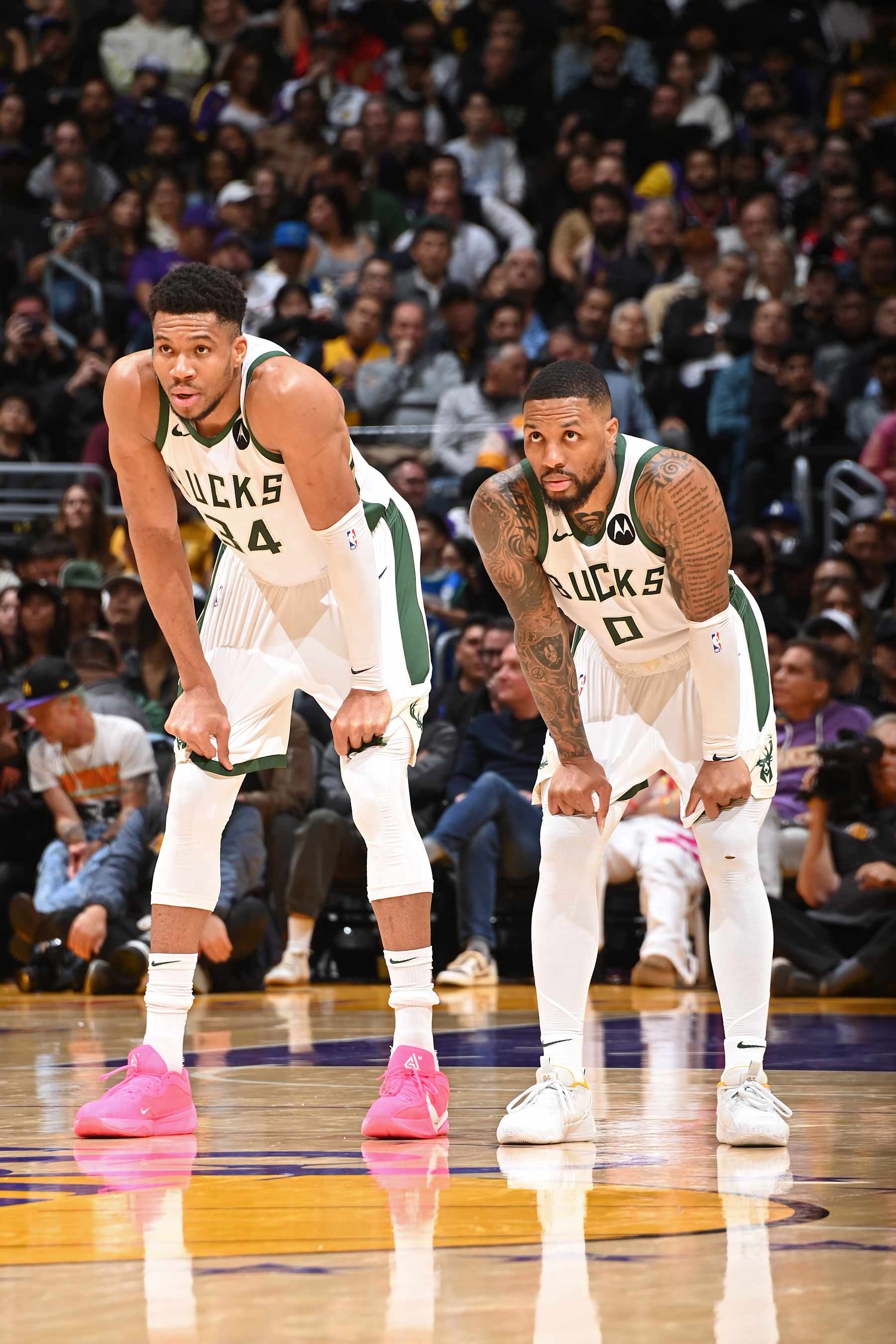 LOS ANGELES, CA - MARCH 8: Giannis Antetokounmpo #34 of the Milwaukee Bucks and Damian Lillard #0 of the Milwaukee Bucks look on during the game against the Los Angeles Lakers on March 8, 2024 at Crypto.Com Arena in Los Angeles, California. NOTE TO USER: User expressly acknowledges and agrees that, by downloading and/or using this Photograph, user is consenting to the terms and conditions of the Getty Images License Agreement. Mandatory Copyright Notice: Copyright 2024 NBAE (Photo by Andrew D. Bernstein/NBAE via Getty Images)