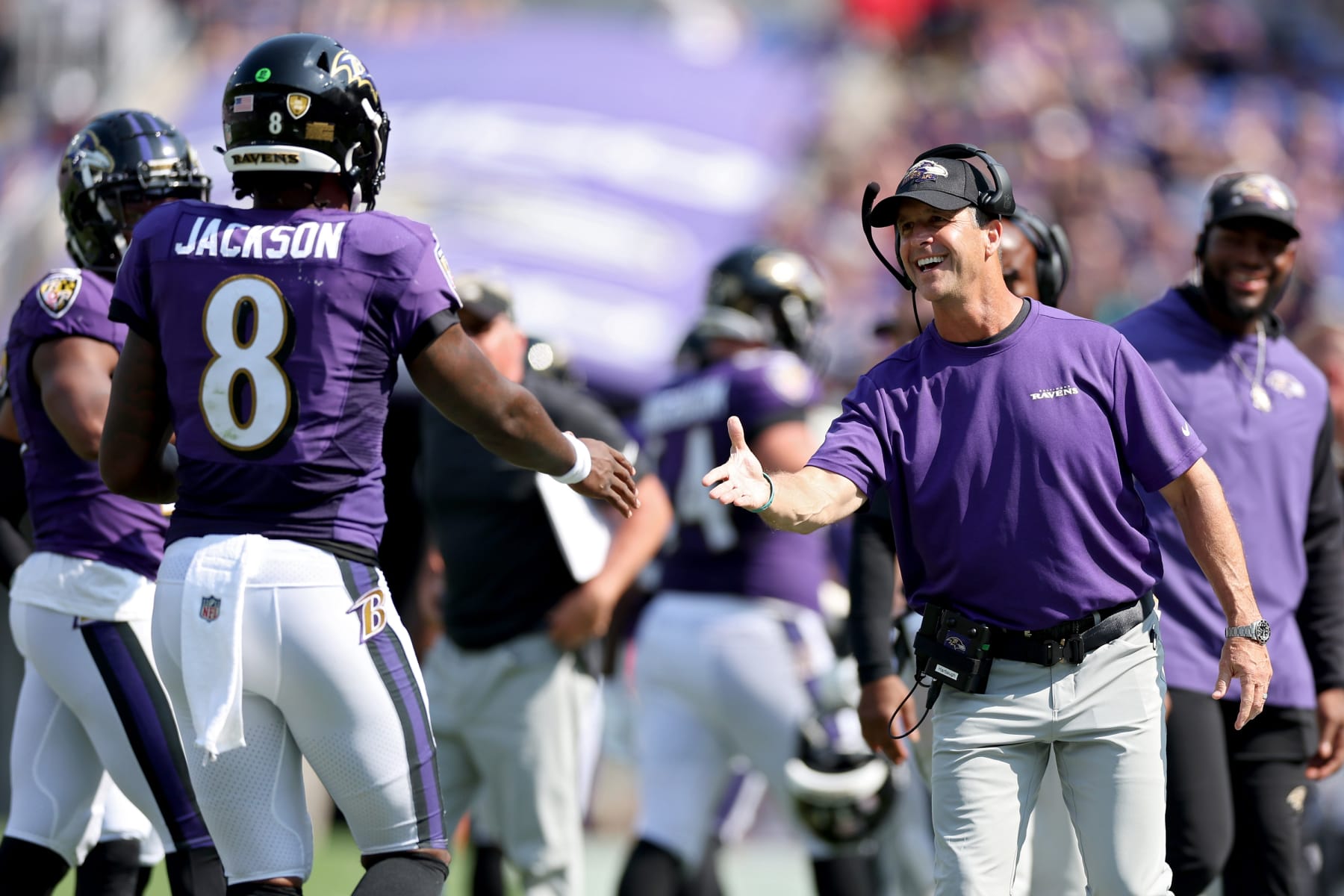BALTIMORE, MARYLAND - SEPTEMBER 18: Baltimore Ravens head coach John Harbaugh celebrates a touchdown with Lamar Jackson #8 in the second quarter against the Miami Dolphins at M&T Bank Stadium on September 18, 2022 in Baltimore, Maryland. (Photo by Patrick Smith/Getty Images) BALTIMORE, MARYLAND - SEPTEMBER 18: Baltimore Ravens head coach John Harbaugh celebrates a touchdown with Lamar Jackson #8 in the second quarter against the Miami Dolphins at M&T Bank Stadium on September 18, 2022 in Baltimore, Maryland. (Photo by Patrick Smith/Getty Images)