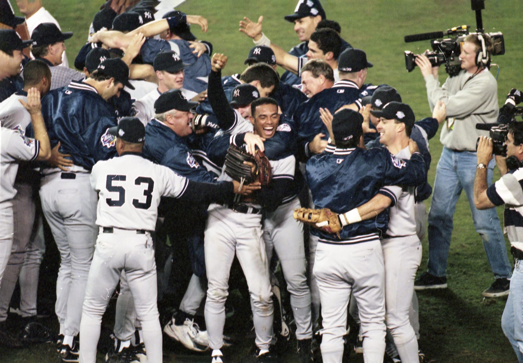 Baseball: World Series: New York Yankees Mariano Rivera (42) and teammates celebrate after winning Game 4 and championship series vs San Diego Padres at Qualcomm Stadium. 
San Diego, CA 10/21/1998 
CREDIT: John W. McDonough (Photo by John W. McDonough /Sports Illustrated via Getty Images) 
(Set Number: X56632)