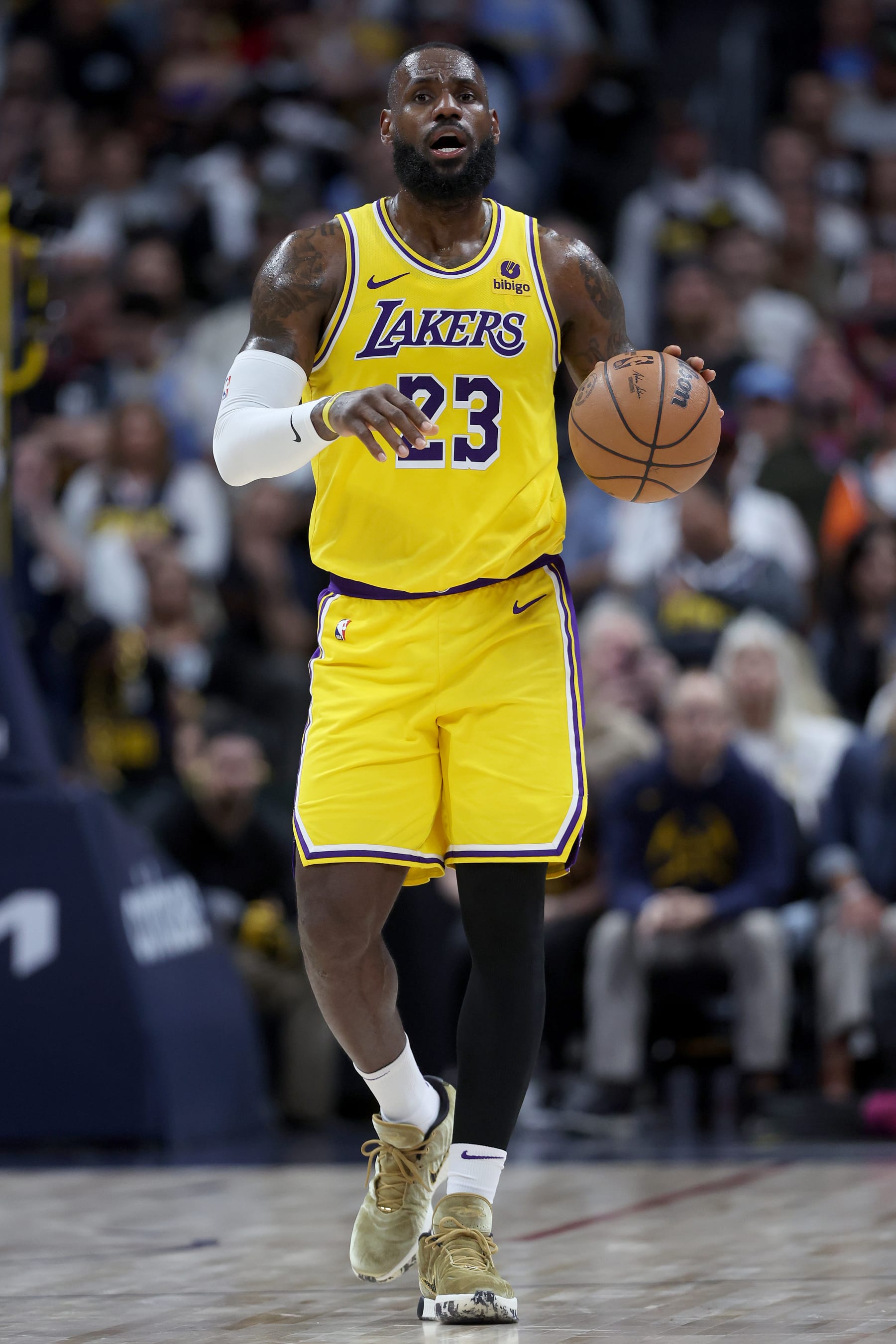 DENVER, COLORADO - APRIL 29: LeBron James #23 of the Los Angeles Lakers brings the ball down the court against the Denver Nuggets in the third quarter during game five of the Western Conference First Round Playoffs at Ball Arena on April 29, 2024 in Denver, Colorado. NOTE TO USER: User expressly acknowledges and agrees that, by downloading and or using this photograph, User is consenting to the terms and conditions of the Getty Images License Agreement.  (Photo by Matthew Stockman/Getty Images)