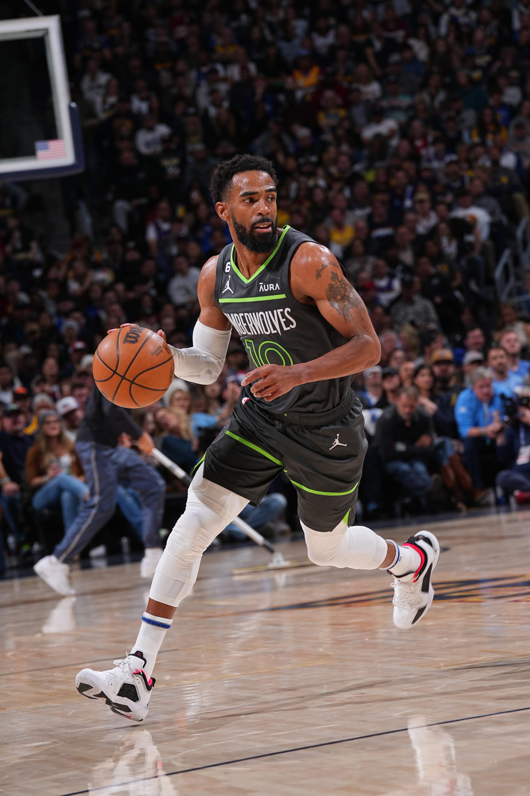 DENVER, CO - APRIL 25: Mike Conley #10 of the Minnesota Timberwolves dribbles the ball during Round One Game Five of the 2023 NBA Playoffs against the Denver Nuggets on April 25, 2023 at the Ball Arena in Denver, Colorado. NOTE TO USER: User expressly acknowledges and agrees that, by downloading and/or using this Photograph, user is consenting to the terms and conditions of the Getty Images License Agreement. Mandatory Copyright Notice: Copyright 2023 NBAE (Photo by Bart Young/NBAE via Getty Images)