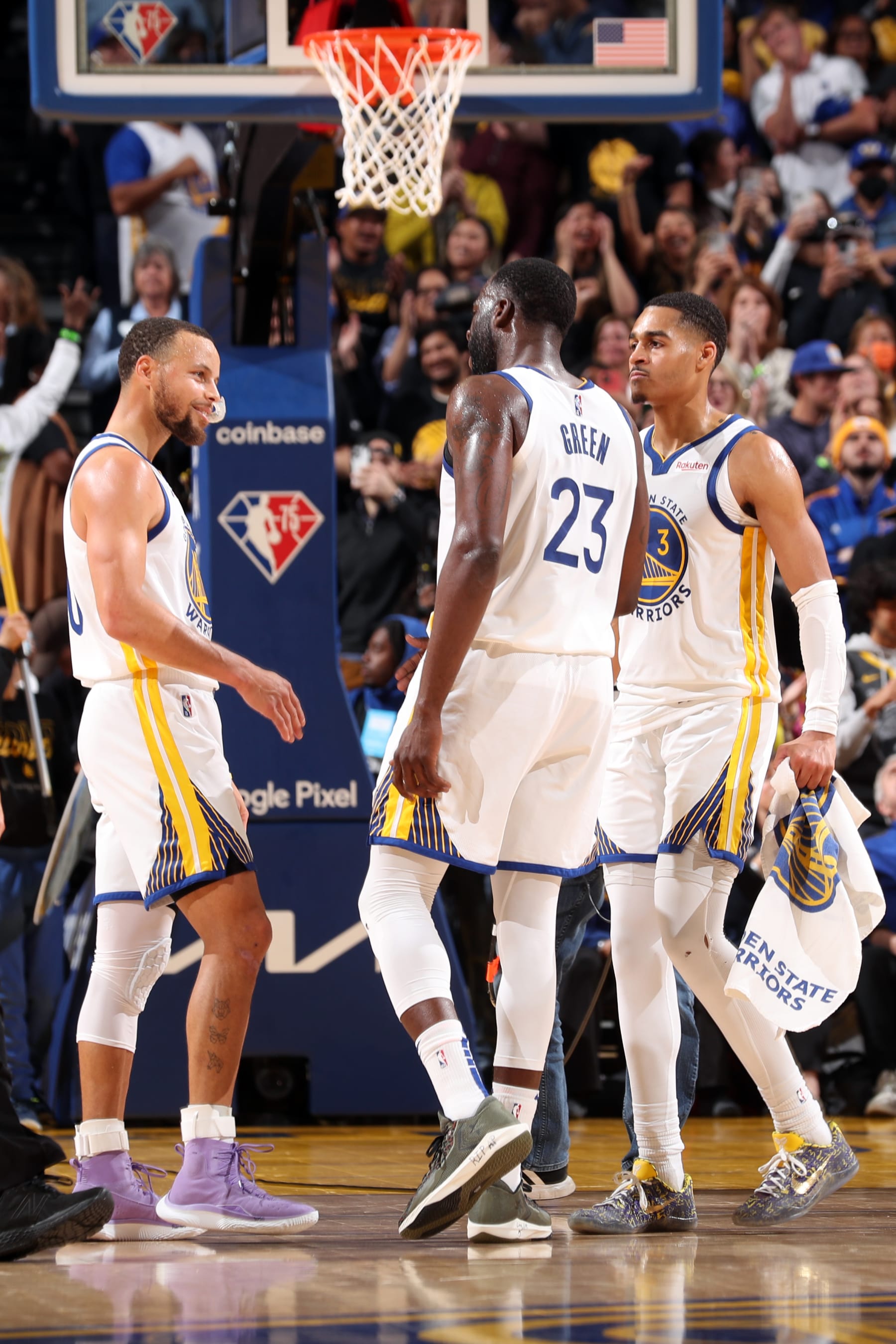 SAN FRANCISCO, CA - MAY 9: Stephen Curry #30 embrace with Draymond Green #23 and Jordan Poole #3 of the Golden State Warriors during Game 4 of the 2022 NBA Playoffs Western Conference Semifinals on May 9, 2022 at Chase Center in San Francisco, California. NOTE TO USER: User expressly acknowledges and agrees that, by downloading and or using this photograph, user is consenting to the terms and conditions of Getty Images License Agreement. Mandatory Copyright Notice: Copyright 2022 NBAE (Photo by Joe Murphy/NBAE via Getty Images)