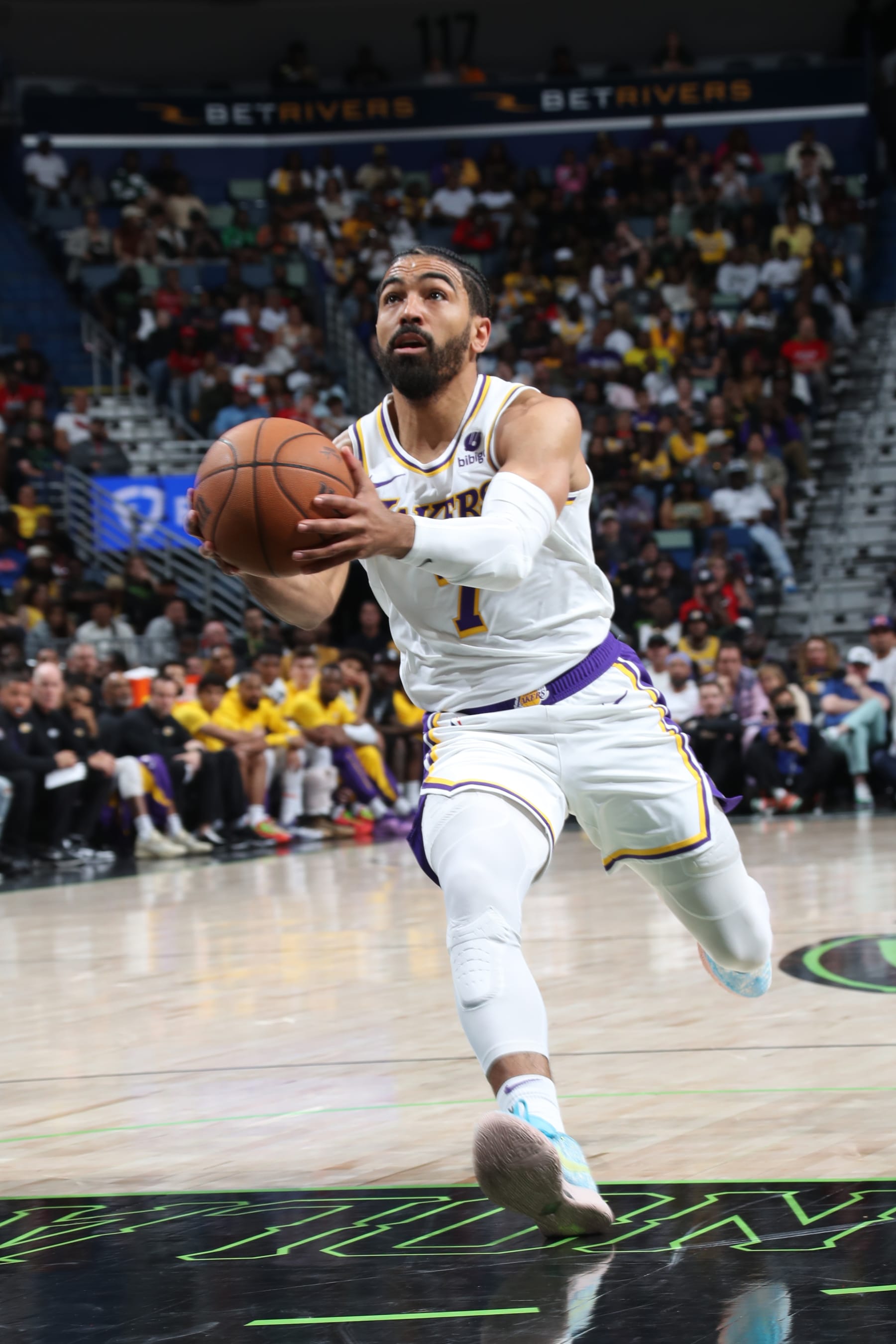 NEW ORLEANS, LA - APRIL 14: Gabe Vincent #7 of the Los Angeles Lakers handles the ball during the game against the New Orleans Pelicans on April 14, 2024 at the Smoothie King Center in New Orleans, Louisiana. NOTE TO USER: User expressly acknowledges and agrees that, by downloading and or using this Photograph, user is consenting to the terms and conditions of the Getty Images License Agreement. Mandatory Copyright Notice: Copyright 2024 NBAE (Photo by Layne Murdoch Jr./NBAE via Getty Images)