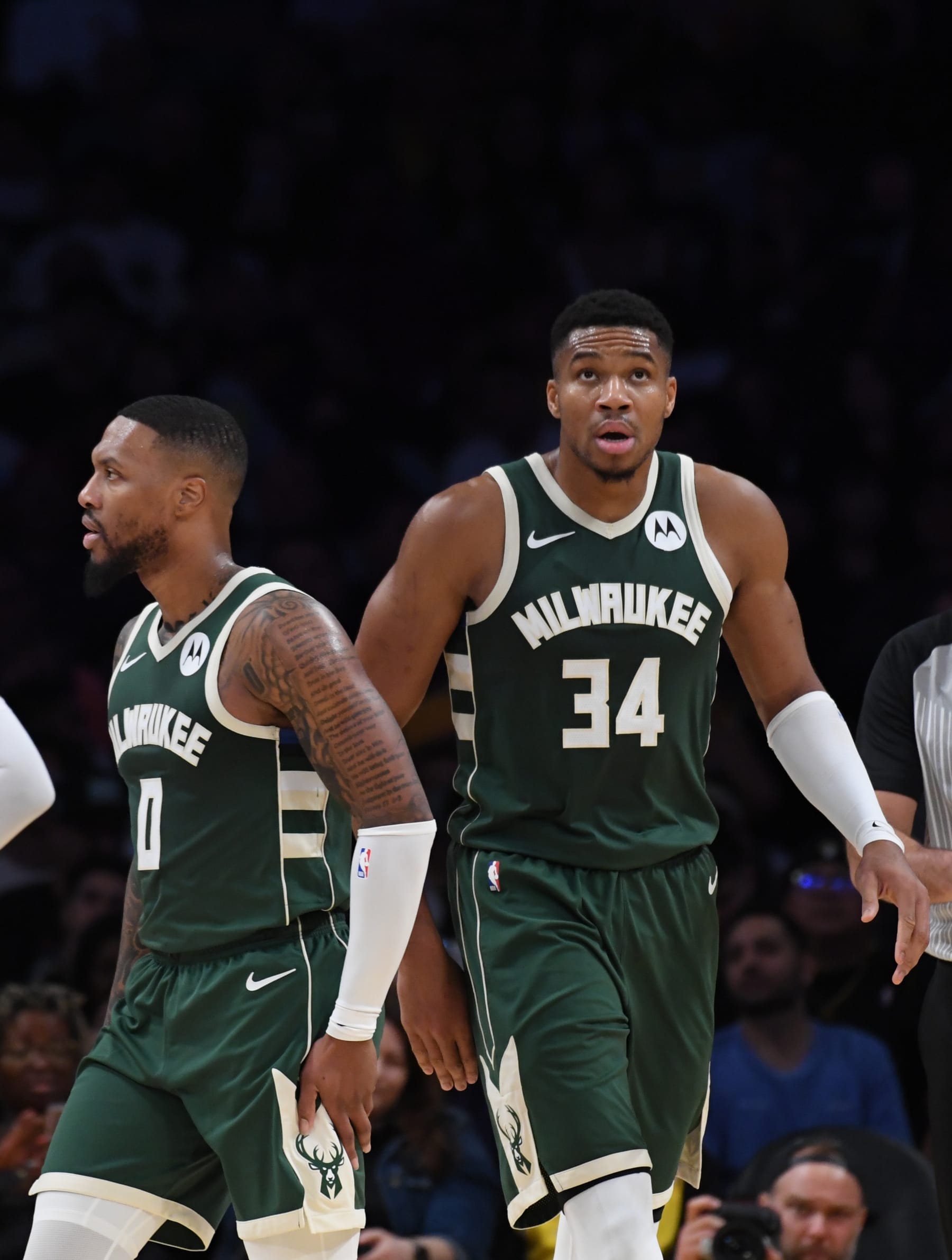 LOS ANGELES, CA - OCTOBER 15: Damian Lillard #0 and Giannis Antetokounmpo #34 of the Milwaukee Bucks look on during the preseason game on October 15, 2023 at Crypto.Com Arena in Los Angeles, California. NOTE TO USER: User expressly acknowledges and agrees that, by downloading and/or using this Photograph, user is consenting to the terms and conditions of the Getty Images License Agreement. Mandatory Copyright Notice: Copyright 2023 NBAE (Photo by Juan Ocampo/NBAE via Getty Images)