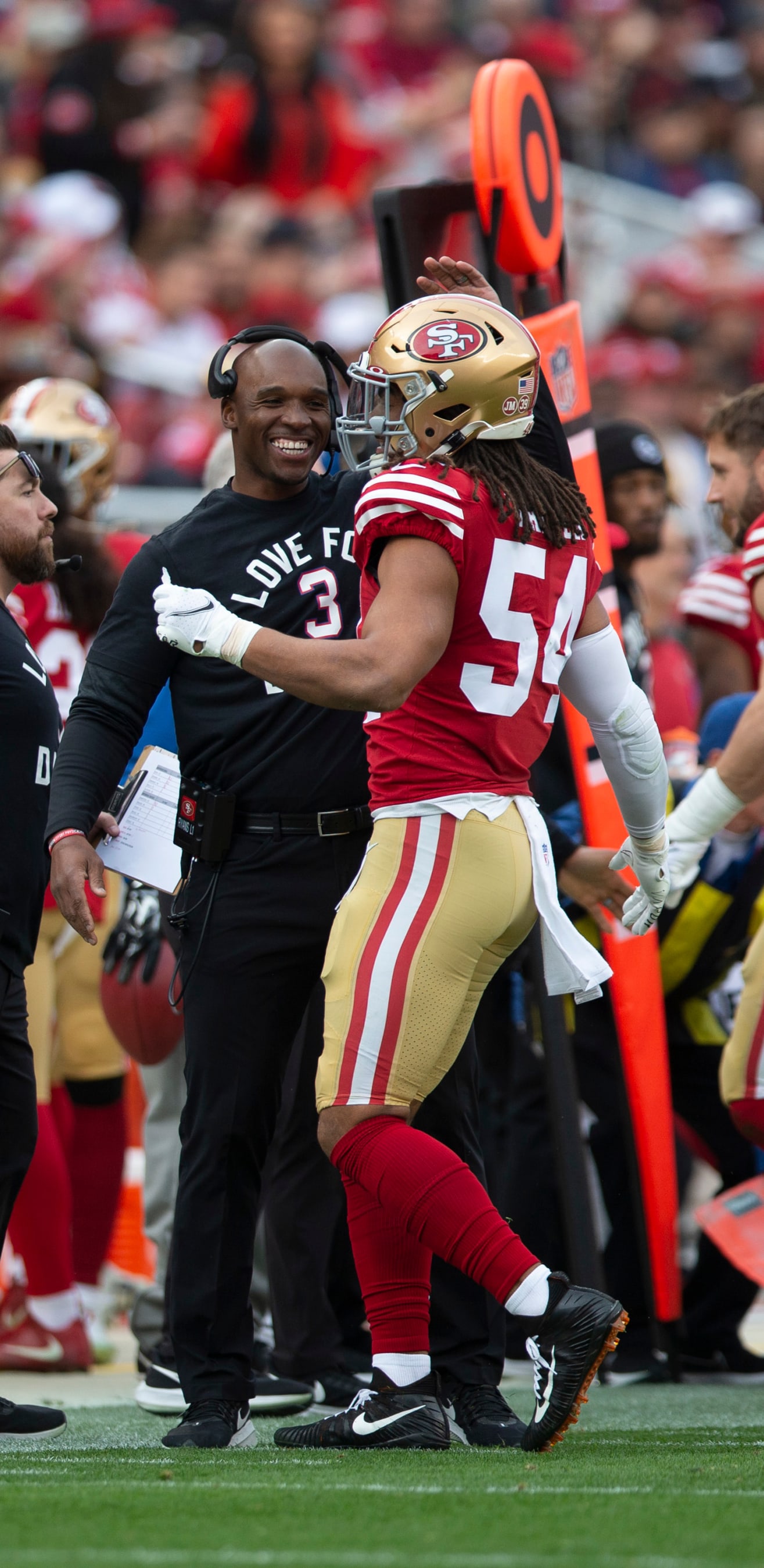 SANTA CLARA, CA - JANUARY 8: Defensive Coordinator DeMeco Ryans and Fred Warner #54 of the San Francisco 49ers celebrate after a turnover on downs during the game against the Arizona Cardinals at Levi's Stadium on January 8, 2023 in Santa Clara, California. The 49ers defeated the Cardinals 38-13. (Photo by Michael Zagaris/San Francisco 49ers/Getty Images)