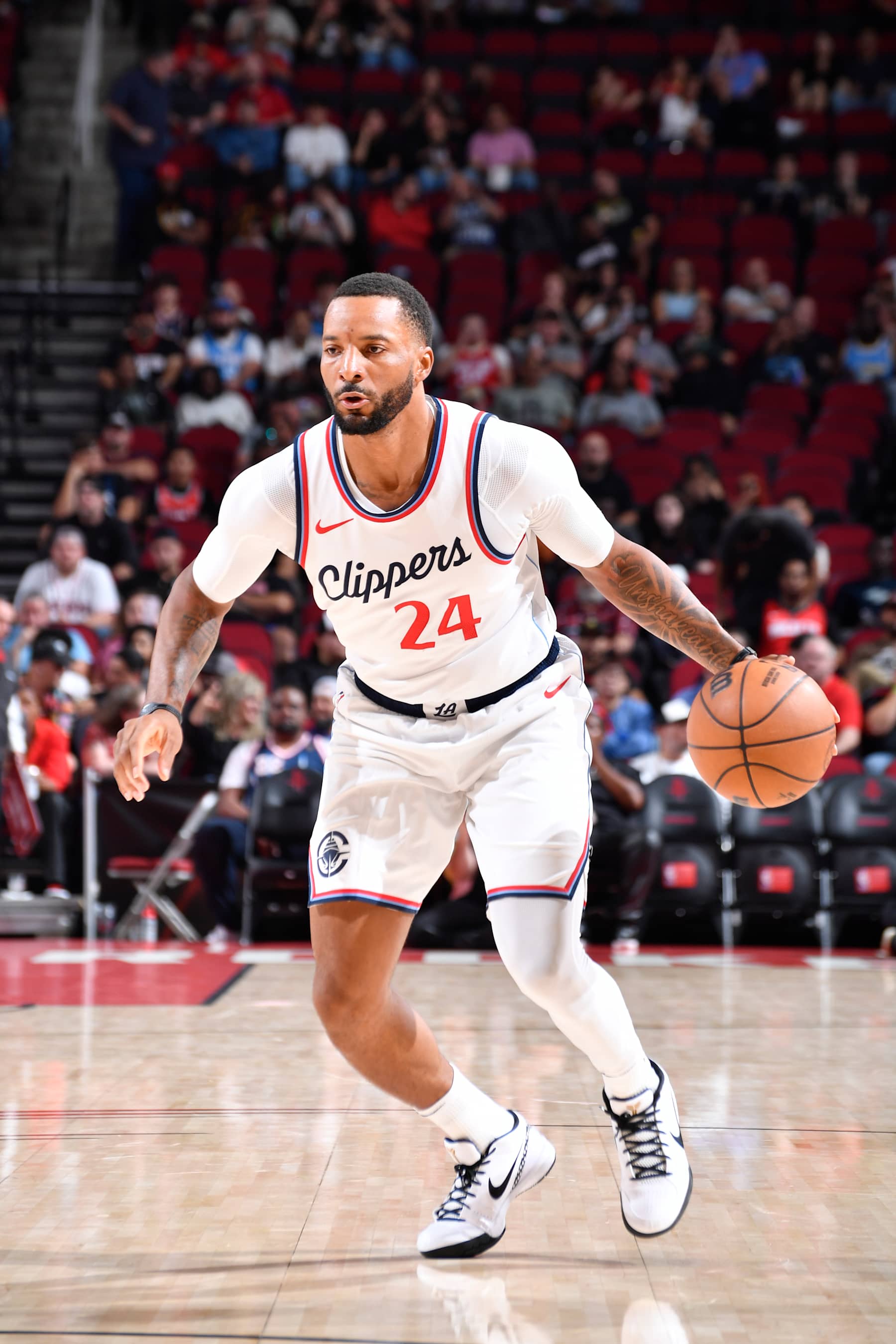 HOUSTON, TX - NOVEMBER 13:  Norman Powell #24 of the LA Clippers dribbles the ball during the game against the Houston Rockets on November 13, 2024 at the Toyota Center in Houston, Texas. NOTE TO USER: User expressly acknowledges and agrees that, by downloading and or using this photograph, User is consenting to the terms and conditions of the Getty Images License Agreement. Mandatory Copyright Notice: Copyright 2024 NBAE (Photo by Logan Riely/NBAE via Getty Images)
