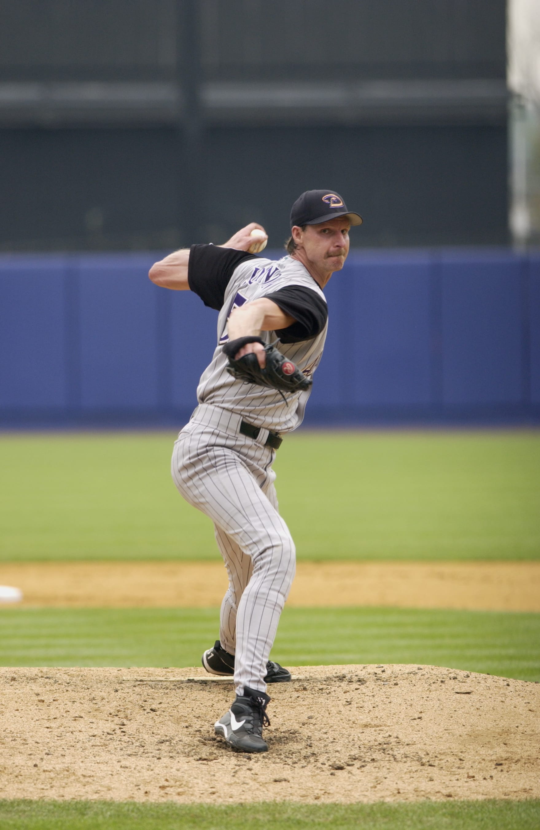 FLUSHING, NY - AUGUST 5:  Pitcher Randy Johnson #51 of the Arizona Diamondbacks throws a pitch during the MLB game against the New York Mets on August 5, 2002 at Shea Stadium in Flushing, New York. The Diamondbacks won 2-0. (Photo by Ezra Shaw/Getty Images)