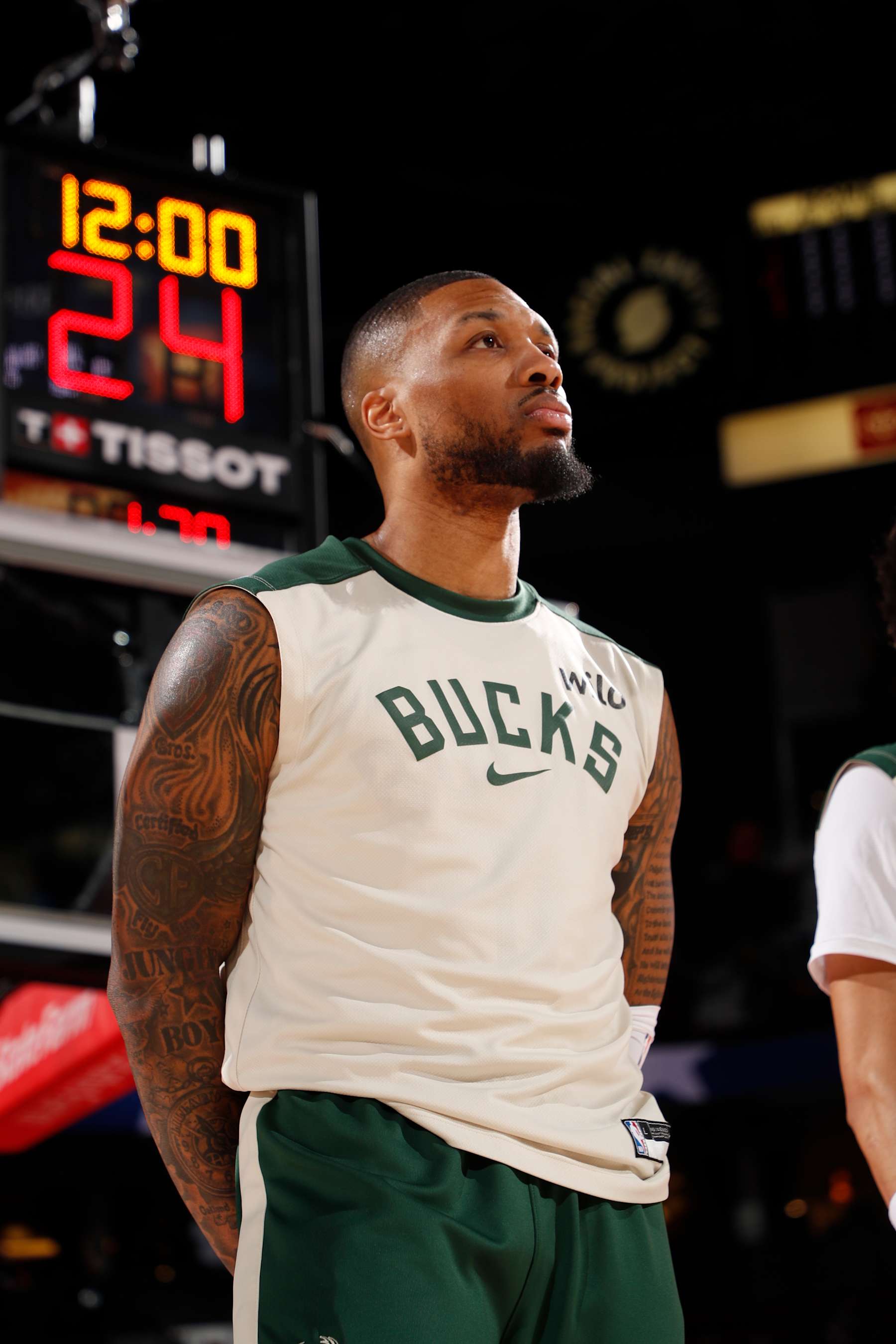PORTLAND, OR - JANUARY 28: Damian Lillard #0 of the Milwaukee Bucks stands for the National Anthem before the game against the Portland Trail Blazers on January 28, 2025 at the Moda Center Arena in Portland, Oregon. NOTE TO USER: User expressly acknowledges and agrees that, by downloading and or using this photograph, user is consenting to the terms and conditions of the Getty Images License Agreement. Mandatory Copyright Notice: Copyright 2025 NBAE (Photo by Cameron Browne/NBAE via Getty Images)