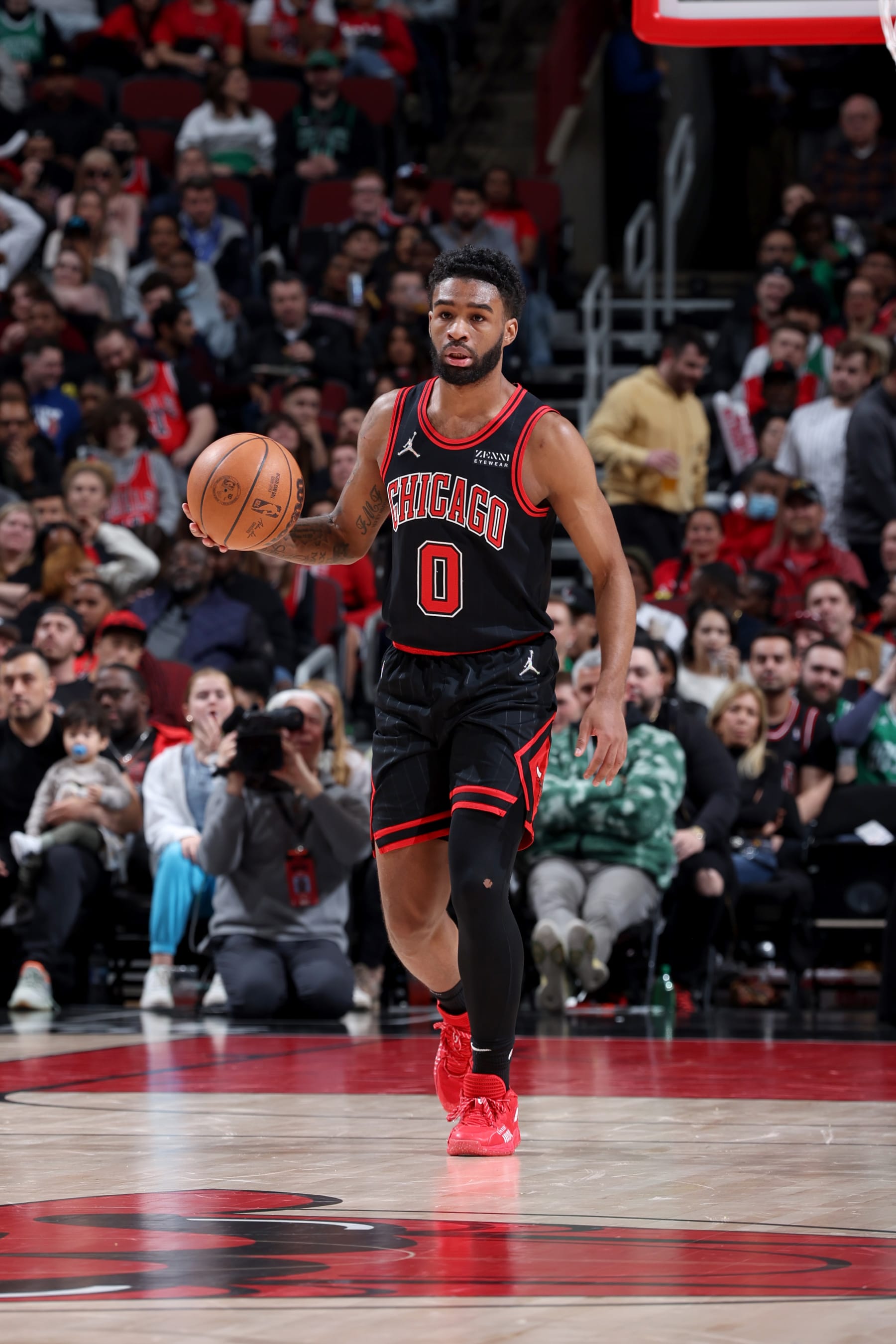 CHICAGO, IL - APRIL 6: Coby White #0 of the Chicago Bulls dribbles the ball during the game against the Boston Celtics on April 6, 2022 at United Center in Chicago, Illinois. NOTE TO USER: User expressly acknowledges and agrees that, by downloading and or using this photograph, User is consenting to the terms and conditions of the Getty Images License Agreement. Mandatory Copyright Notice: Copyright 2022 NBAE (Photo by Jeff Haynes/NBAE via Getty Images)