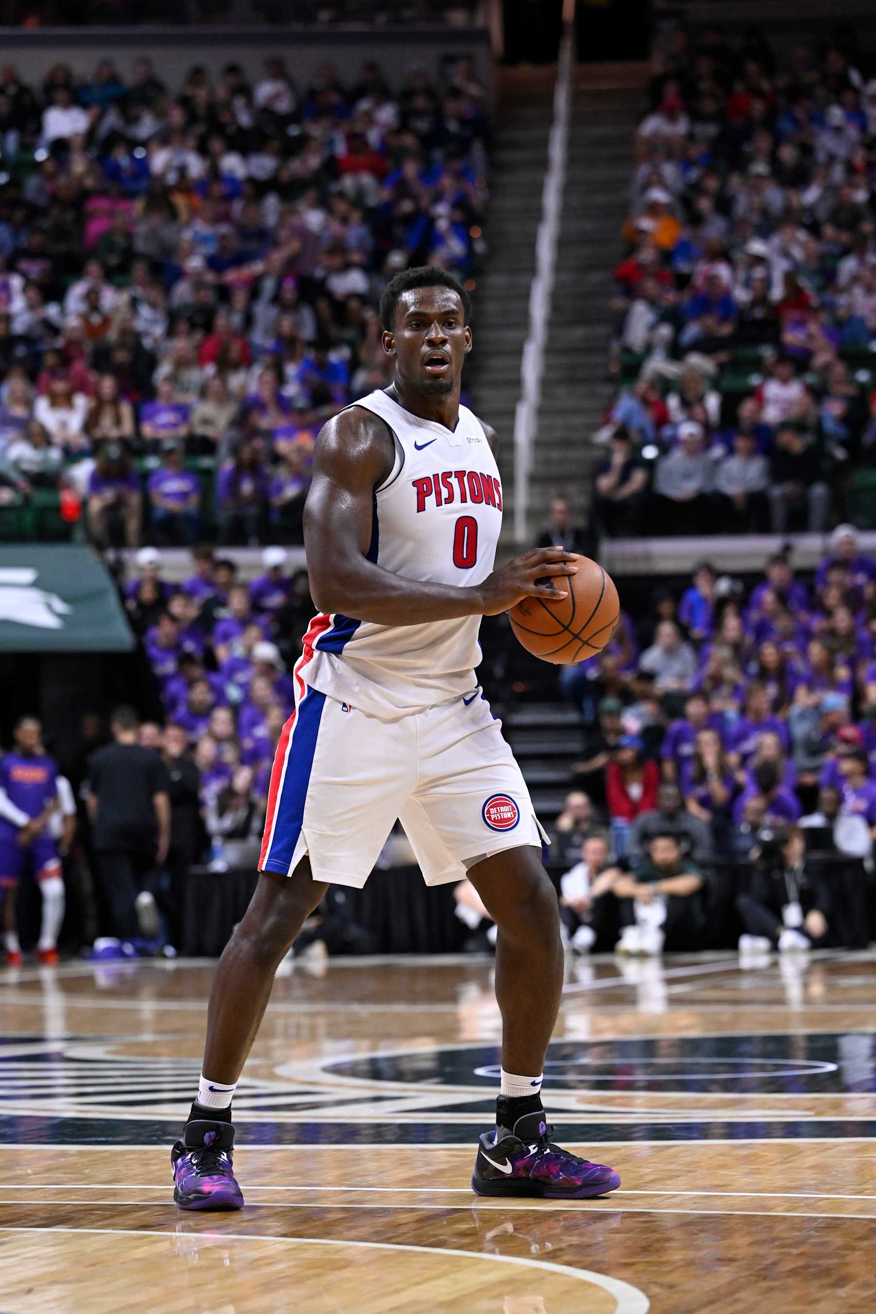 EAST LANSING, MI - OCTOBER 8: Jalen Duren #0 of the Detroit Pistons looks to pass the ball during the game against the Phoenix Suns during a NBA Preseason game on October 8, 2024 at the Breslin Center in East Lansing, Michigan. NOTE TO USER: User expressly acknowledges and agrees that, by downloading and/or using this photograph, User is consenting to the terms and conditions of the Getty Images License Agreement. Mandatory Copyright Notice: Copyright 2024 NBAE (Photo by Chris Schwegler/NBAE via Getty Images)