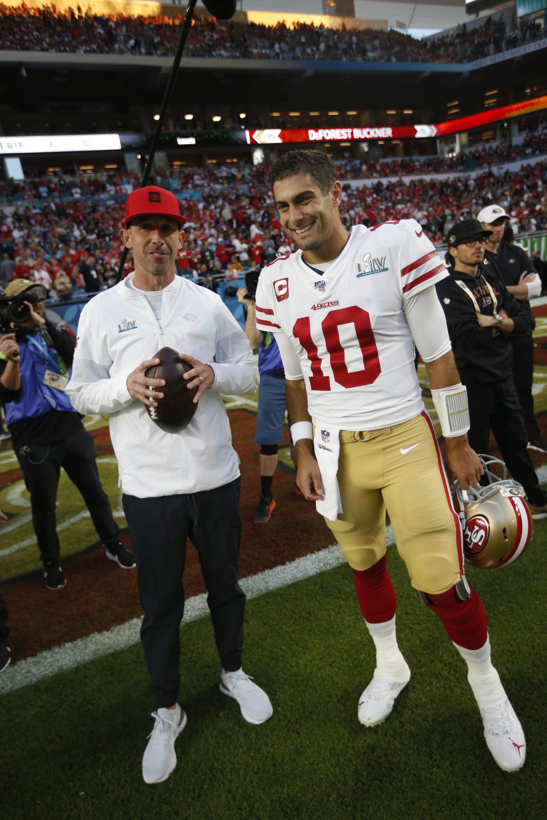 MIAMI, FLORIDA - FEBRUARY 2: Head Coach Kyle Shanahan and Jimmy Garoppolo #10 of the San Francisco 49ers talk on the field before the game against the Kansas City Chiefs in Super Bowl LIV at Hard Rock Stadium on February 2, 2020 in Miami, Florida. The Chiefs defeated the 49ers 31-20. (Photo by Michael Zagaris/San Francisco 49ers/Getty Images)