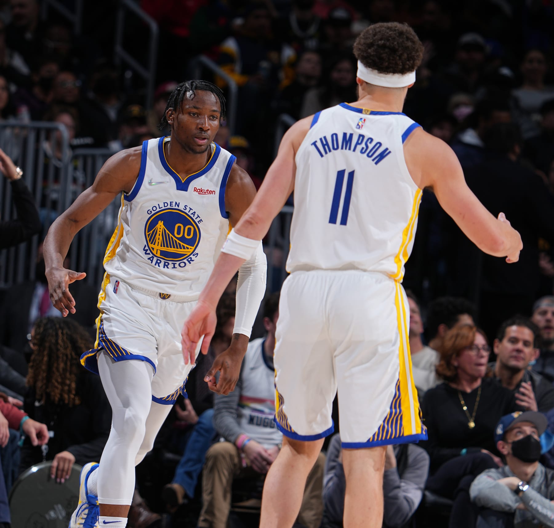 DENVER, CO - MARCH 10: Jonathan Kuminga #00 and Klay Thompson #11 of the Golden State Warriors embrace during the game against the Denver Nuggets on March 10, 2022 at the Ball Arena in Denver, Colorado. NOTE TO USER: User expressly acknowledges and agrees that, by downloading and/or using this Photograph, user is consenting to the terms and conditions of the Getty Images License Agreement. Mandatory Copyright Notice: Copyright 2022 NBAE (Photo by Bart Young/NBAE via Getty Images)
