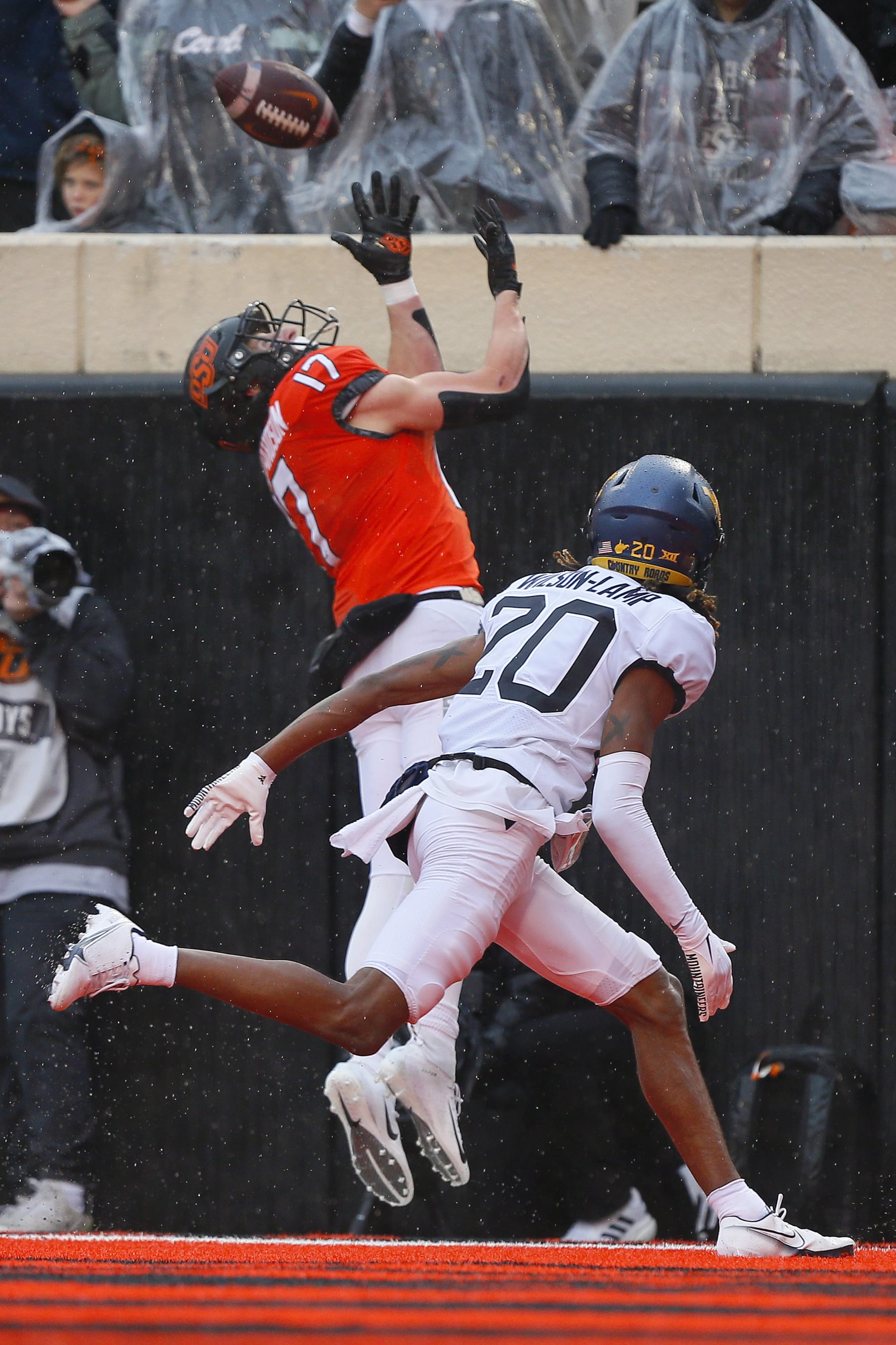 STILLWATER, OK - NOVEMBER 26:  Wide receiver John Paul Richardson #17 of the Oklahoma State Cowboys can't make the catch in the end zone against cornerback Andrew Wilson-Lamp #20 of the West Virginia Mountaineers in the second quarter at Boone Pickens Stadium on November 26, 2022 in Stillwater, Oklahoma.  Oklahoma State settled for a field goal on the drive.  West Virginia won 24-19.  (Photo by Brian Bahr/Getty Images)