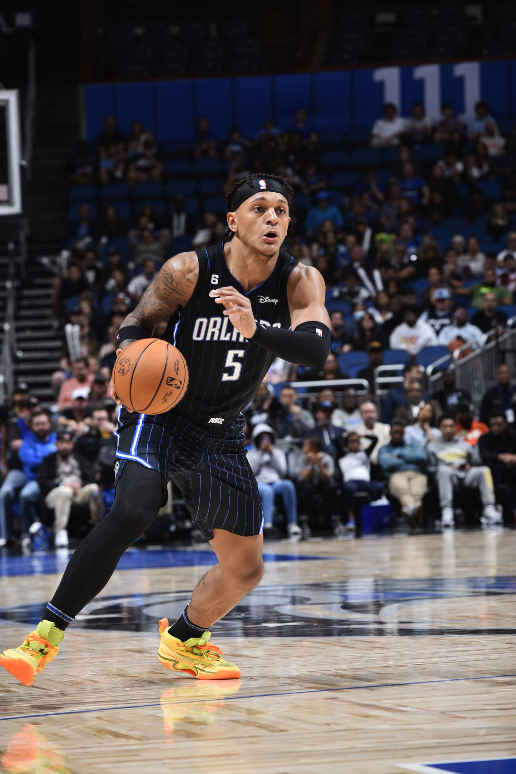 ORLANDO, FL - NOVEMBER 7: Paolo Banchero #5 of the Orlando Magic handles the ball during the game against the Houston Rockets on November 7, 2022 at Amway Center in Orlando, Florida. NOTE TO USER: User expressly acknowledges and agrees that, by downloading and or using this photograph, User is consenting to the terms and conditions of the Getty Images License Agreement. Mandatory Copyright Notice: Copyright 2022 NBAE (Photo by Gary Bassing/NBAE via Getty Images)