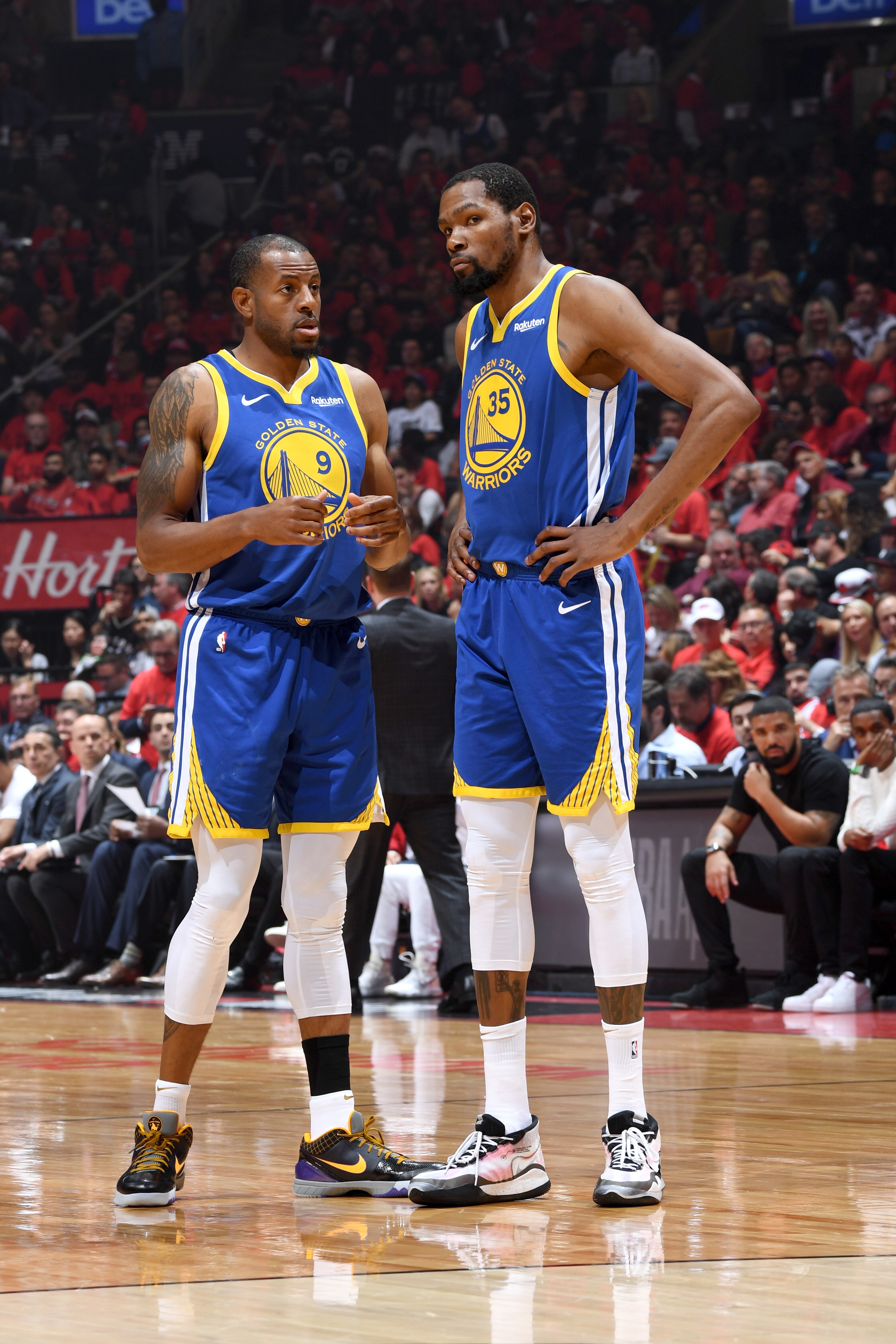 TORONTO, CANADA - JUNE 10: Andre Iguodala #9 and Kevin Durant #35 of the Golden State Warriors talk during Game Five of the NBA Finals against the Toronto Raptors on June 10, 2019 at Scotiabank Arena in Toronto, Ontario, Canada. NOTE TO USER: User expressly acknowledges and agrees that, by downloading and/or using this photograph, user is consenting to the terms and conditions of the Getty Images License Agreement. Mandatory Copyright Notice: Copyright 2019 NBAE (Photo by Andrew D. Bernstein/NBAE via Getty Images)
