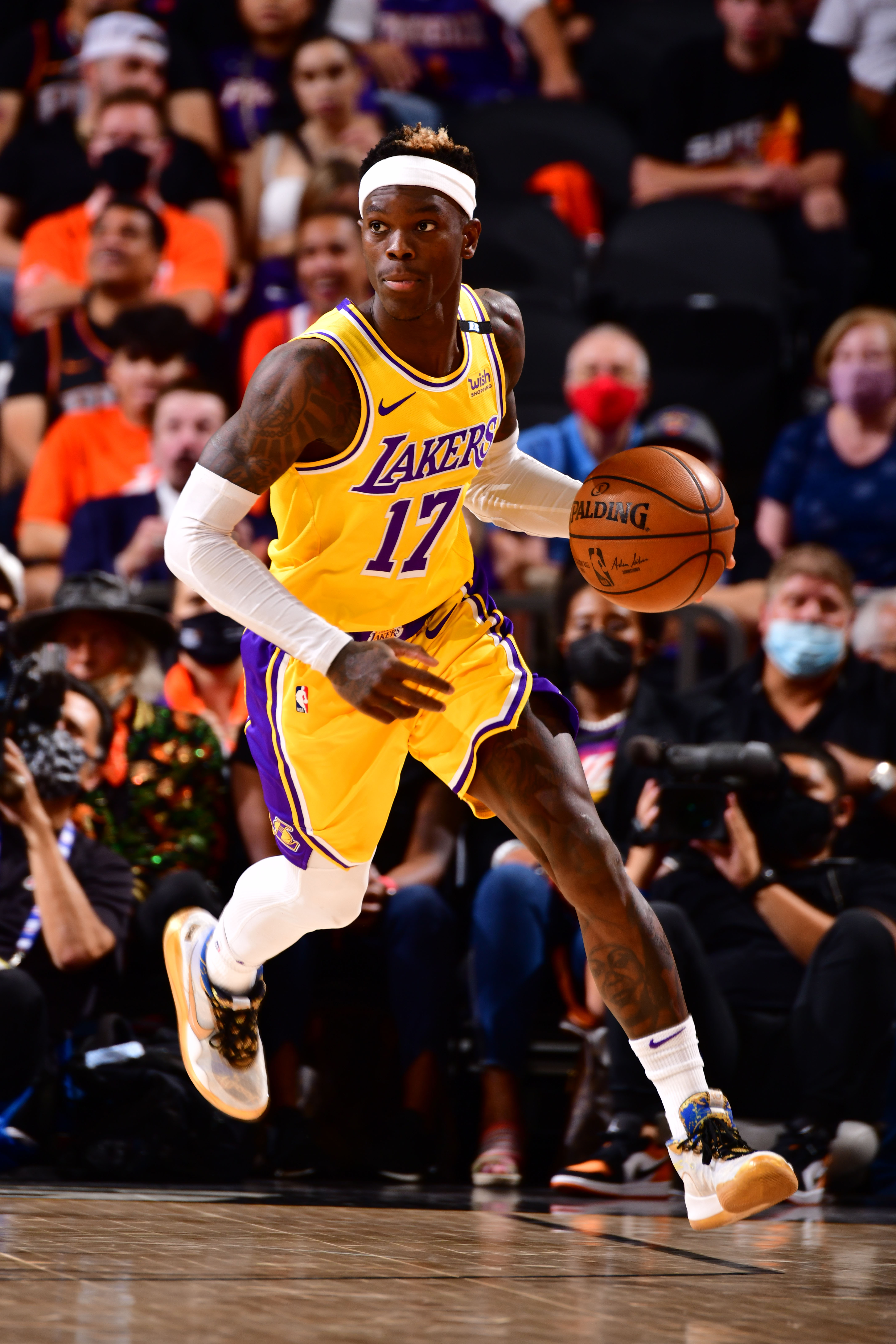 PHOENIX, AZ - JUNE 1: Dennis Schroder #17 of the Los Angeles Lakers dribbles the ball during the game against the Phoenix Suns during Round 1, Game 5 of the 2021 NBA Playoffs on June 1, 2021 at Phoenix Suns Arena in Phoenix, Arizona. NOTE TO USER: User expressly acknowledges and agrees that, by downloading and or using this photograph, user is consenting to the terms and conditions of the Getty Images License Agreement. Mandatory Copyright Notice: Copyright 2021 NBAE (Photo by Barry Gossage/NBAE via Getty Images)