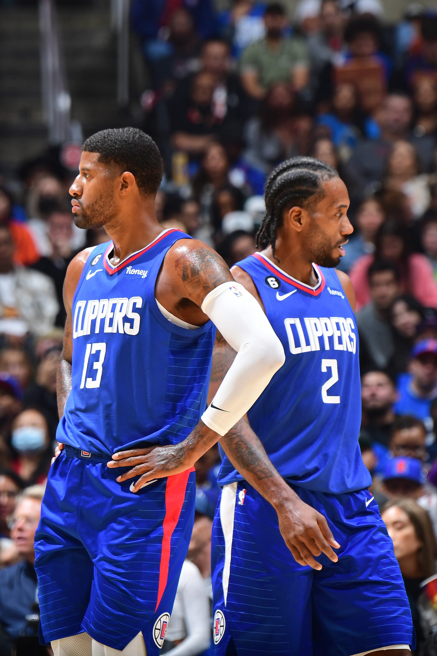 LOS ANGELES, CA - OCTOBER 23: Paul George #13 and Kawhi Leonard #2 of the LA Clippers looks on during the game against the Phoenix Suns on October 23, 2022 at Crypto.Com Arena in Los Angeles, California. NOTE TO USER: User expressly acknowledges and agrees that, by downloading and/or using this Photograph, user is consenting to the terms and conditions of the Getty Images License Agreement. Mandatory Copyright Notice: Copyright 2022 NBAE (Photo by Adam Pantozzi/NBAE via Getty Images)