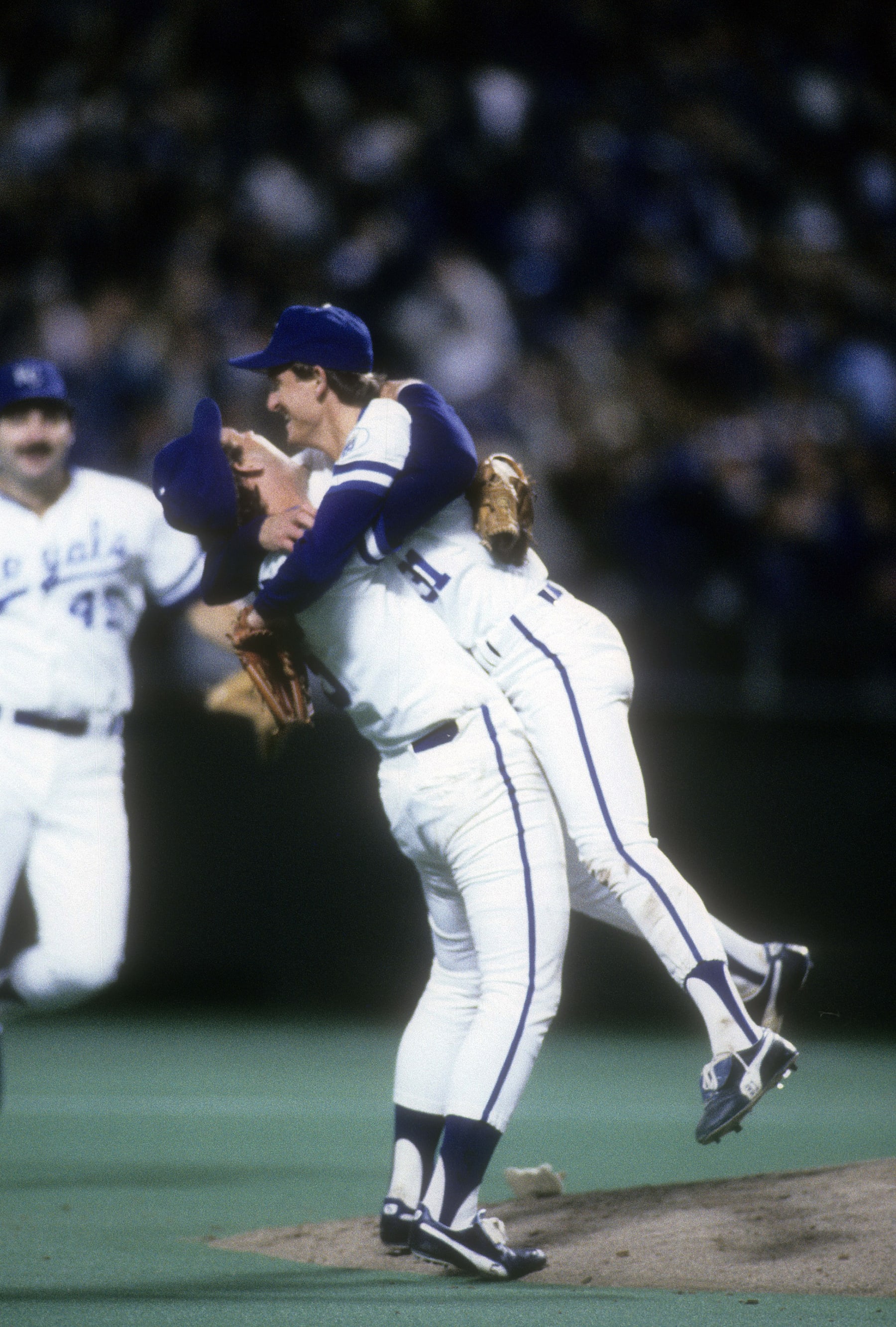 KANSAS CIT, MO - OCTOBER 27, 1985: Pitcher Bret Saberhagen #31 and Third baseman George Brett #5 celebrates after Saberhagen pitches a complete game shutout in game seven of the World Series, October 27, 1985 at Royals Stadium in Kansas City, Missouri. The Royals won the game 11-0 and the World Series 4 games to 3. Saberhagen played for the Royals from 1984-91. (Photo by Focus on Sport/Getty Images)
