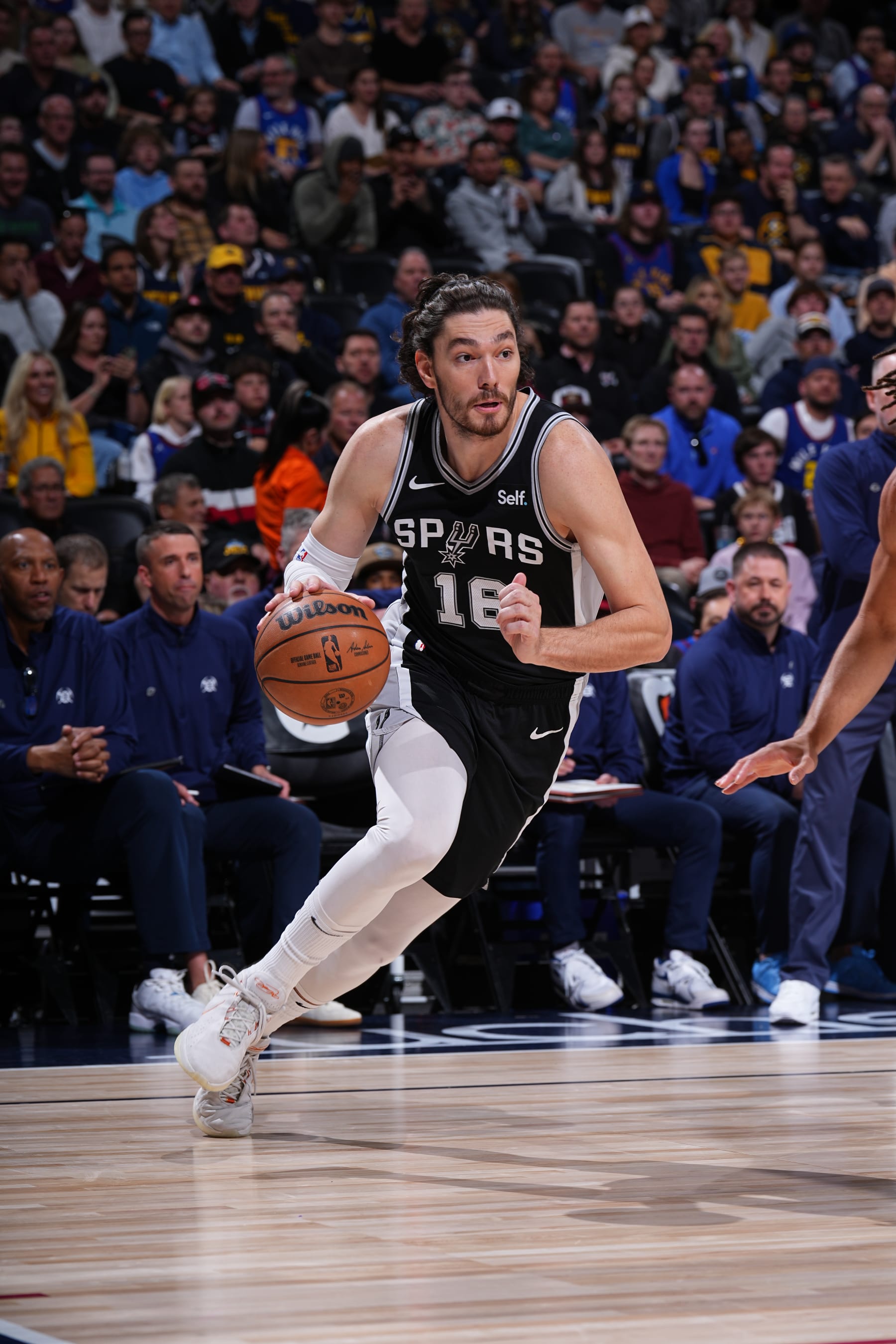 DENVER, CO - APRIL 2: Cedi Osman #16 of the San Antonio Spurs handles the ball during the game against the Denver Nuggets on April 2, 2024 at the Ball Arena in Denver, Colorado. NOTE TO USER: User expressly acknowledges and agrees that, by downloading and/or using this Photograph, user is consenting to the terms and conditions of the Getty Images License Agreement. Mandatory Copyright Notice: Copyright 2024 NBAE (Photo by Garrett Ellwood/NBAE via Getty Images)
