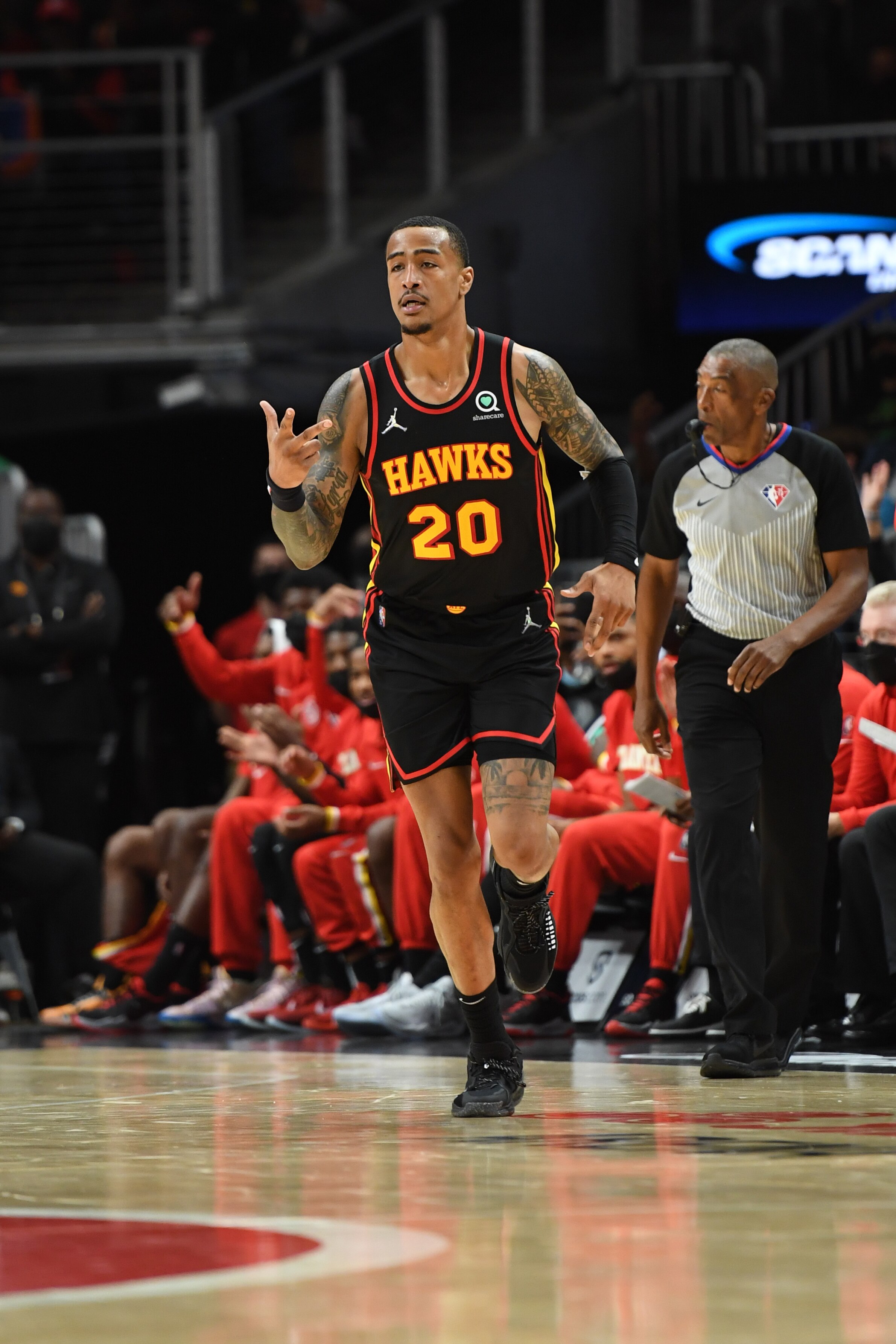 ATLANTA, GA - NOVEMBER 17: John Collins #20 of the Atlanta Hawks celebrates a three point basket during the game against the Atlanta Hawks on November 17, 2021 at State Farm Arena in Atlanta, Georgia.  NOTE TO USER: User expressly acknowledges and agrees that, by downloading and/or using this Photograph, user is consenting to the terms and conditions of the Getty Images License Agreement. Mandatory Copyright Notice: Copyright 2021 NBAE (Photo by Adam Hagy/NBAE via Getty Images)