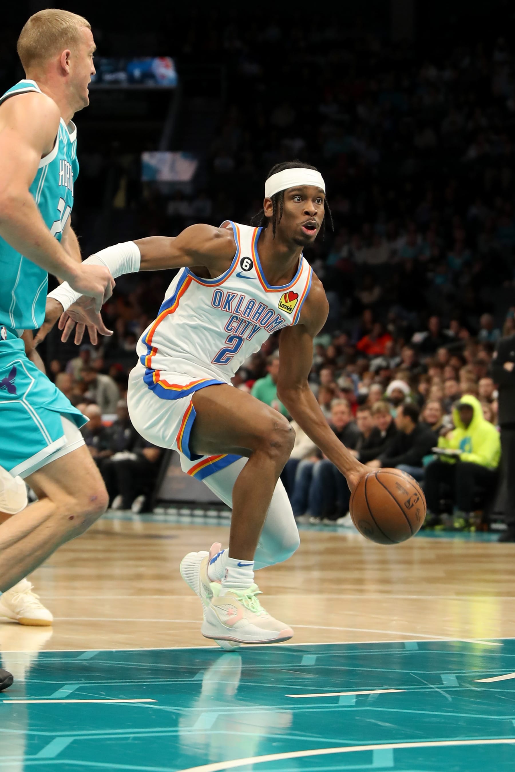 CHARLOTTE, NC - DECEMBER 29: Shai Gilgeous-Alexander #2 of the Oklahoma City Thunder drives to the basket against the Charlotte Hornets on December 29, 2022 at Spectrum Center in Charlotte, North Carolina. NOTE TO USER: User expressly acknowledges and agrees that, by downloading and or using this photograph, User is consenting to the terms and conditions of the Getty Images License Agreement.  Mandatory Copyright Notice:  Copyright 2022 NBAE (Photo by Brock Williams-Smith/NBAE via Getty Images)