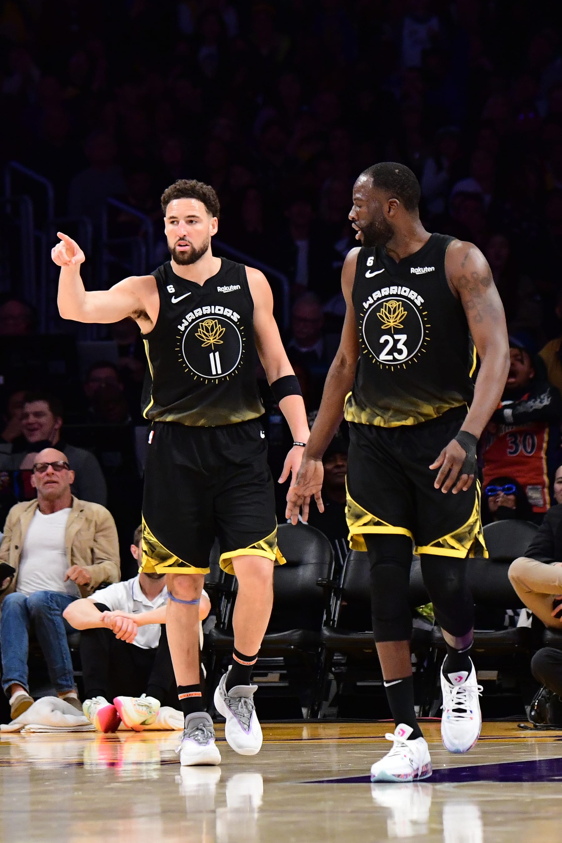 LOS ANGELES, CA - MARCH 5: Klay Thompson #11 and Draymond Green #23 of the Golden State Warriors look on during the game against the Los Angeles Lakers on March 5, 2023 at Crypto.Com Arena in Los Angeles, California. NOTE TO USER: User expressly acknowledges and agrees that, by downloading and/or using this Photograph, user is consenting to the terms and conditions of the Getty Images License Agreement. Mandatory Copyright Notice: Copyright 2023 NBAE (Photo by Adam Pantozzi/NBAE via Getty Images)