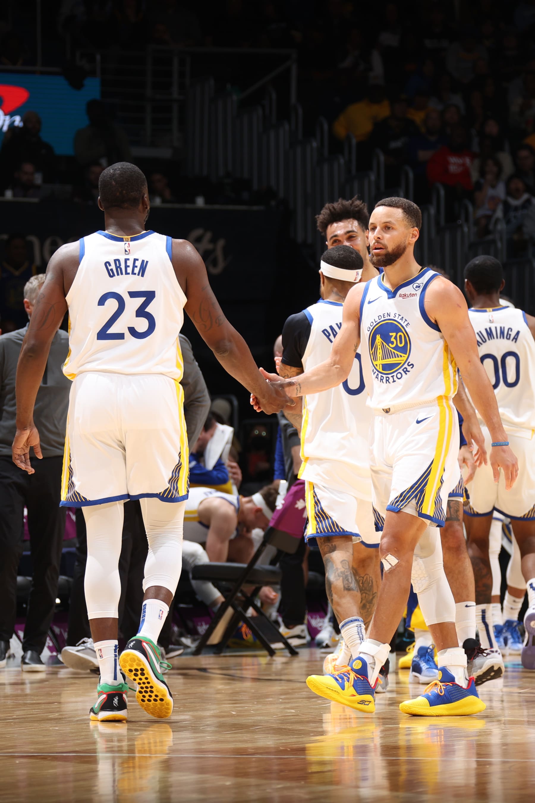 WASHINGTON, DC -  FEBRUARY 27: Draymond Green #23 of the Golden State Warriors high fives Stephen Curry #30 during the game against the Washington Wizards on February 27, 2024 at Capital One Arena in Washington, DC. NOTE TO USER: User expressly acknowledges and agrees that, by downloading and or using this Photograph, user is consenting to the terms and conditions of the Getty Images License Agreement. Mandatory Copyright Notice: Copyright 2024 NBAE (Photo by Stephen Gosling/NBAE via Getty Images)