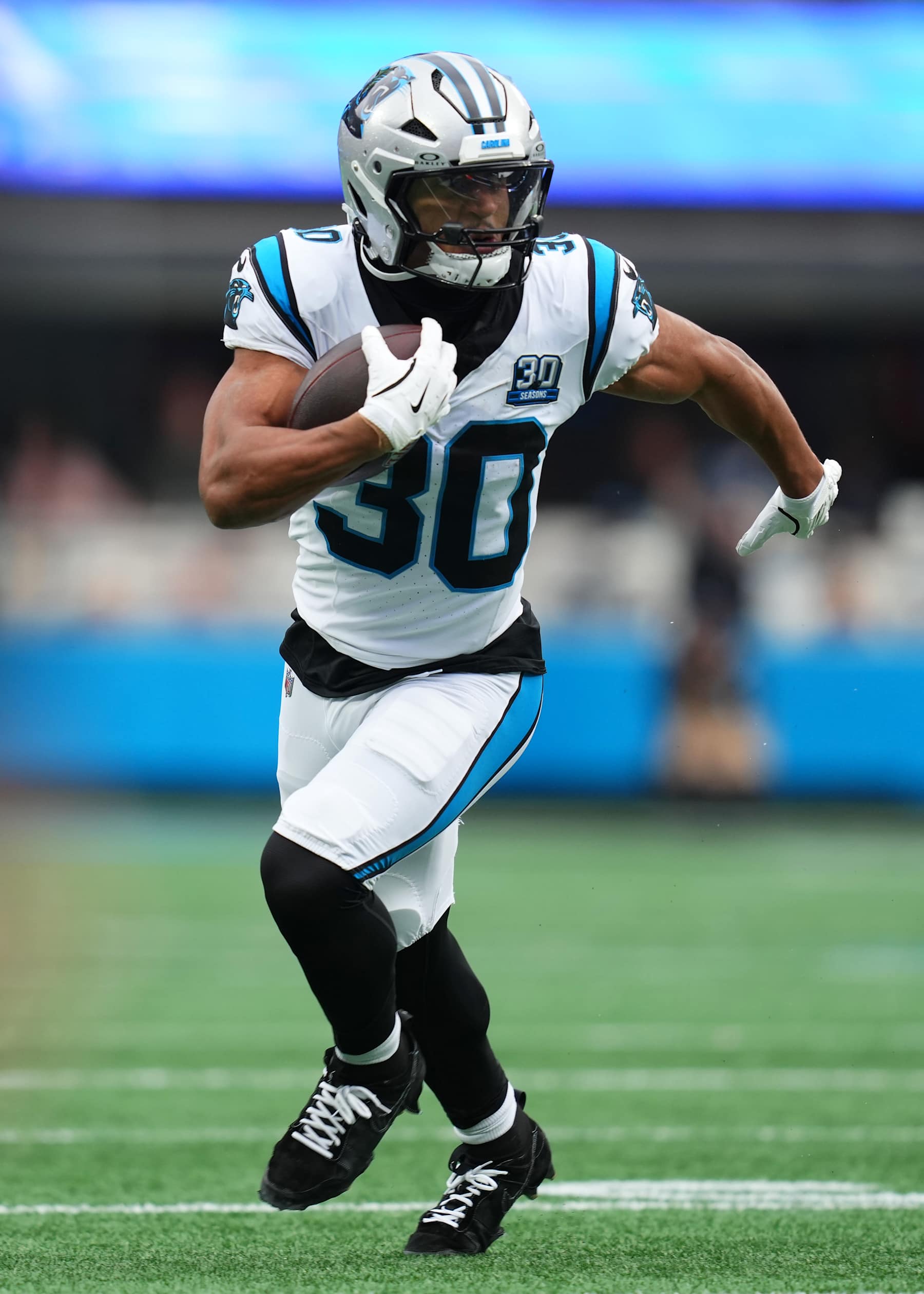 CHARLOTTE, NORTH CAROLINA - DECEMBER 15: Chuba Hubbard #30 of the Carolina Panthers carries the ball against the Dallas Cowboys during the first quarter at Bank of America Stadium on December 15, 2024 in Charlotte, North Carolina. (Photo by Grant Halverson/Getty Images)