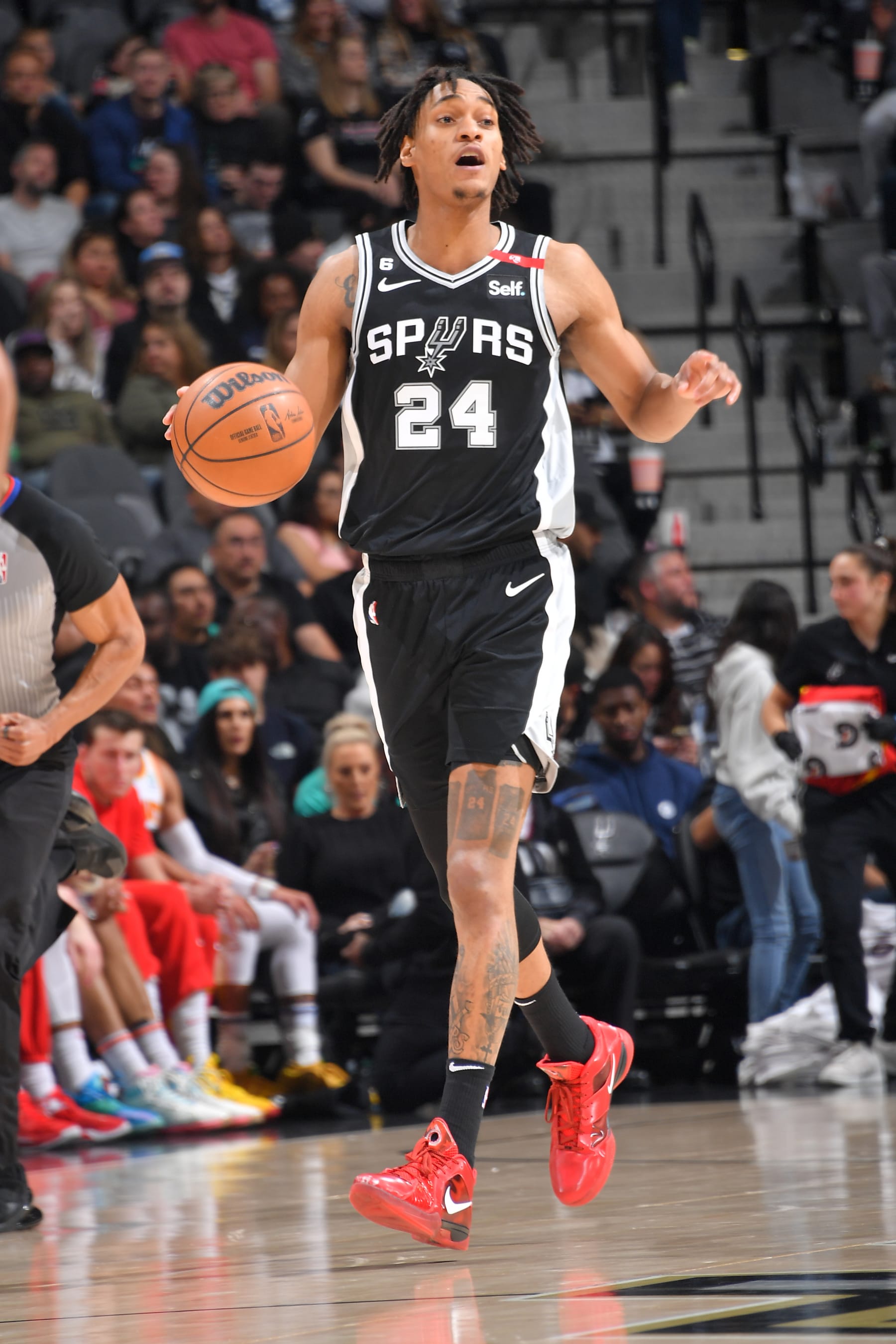 SAN ANTONIO, TX - MARCH19:  Devin Vassell #24 of the San Antonio Spurs goes to the basket during the game on March 19, 2023 at the AT&T Center in San Antonio, Texas. NOTE TO USER: User expressly acknowledges and agrees that, by downloading and or using this photograph, user is consenting to the terms and conditions of the Getty Images License Agreement. Mandatory Copyright Notice: Copyright 2023 NBAE (Photos by Michael Gonzales/NBAE via Getty Images)
