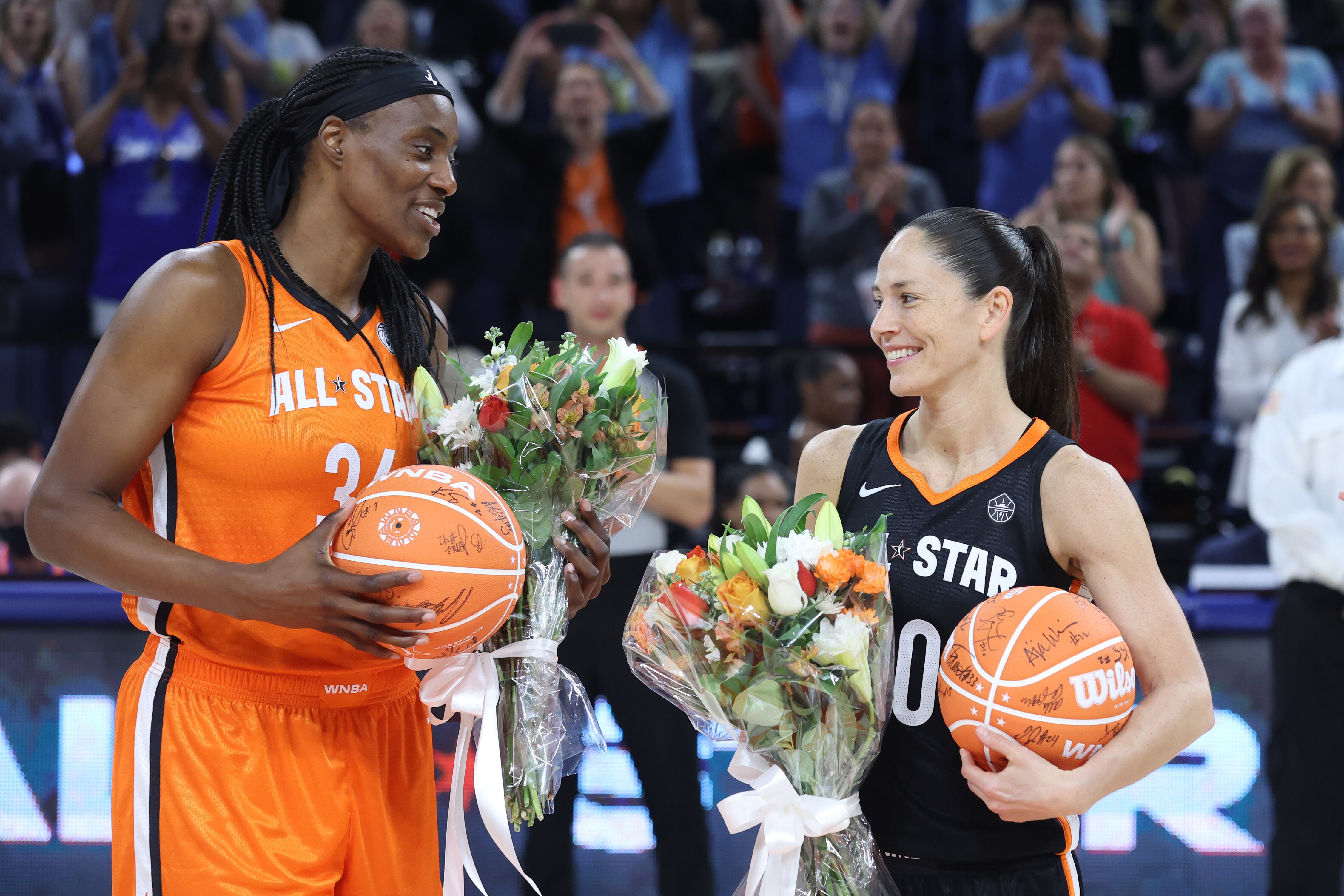CHICAGO, IL - JULY 10: Sylvia Fowles #34 of Team Wilson and Sue Bird #10 of Team Stewart receive a bouquet and a signed basketball from their teammates during the 2022 AT&T WNBA All-Star Game on July 10, 2022 at Wintrust Arena in Chicago, Illinois. NOTE TO USER: User expressly acknowledges and agrees that, by downloading and or using this photograph, User is consenting to the terms and conditions of the Getty Images License Agreement. Mandatory Copyright Notice: Copyright 2022 NBAE (Photo by Jeff Haynes/NBAE via Getty Images)