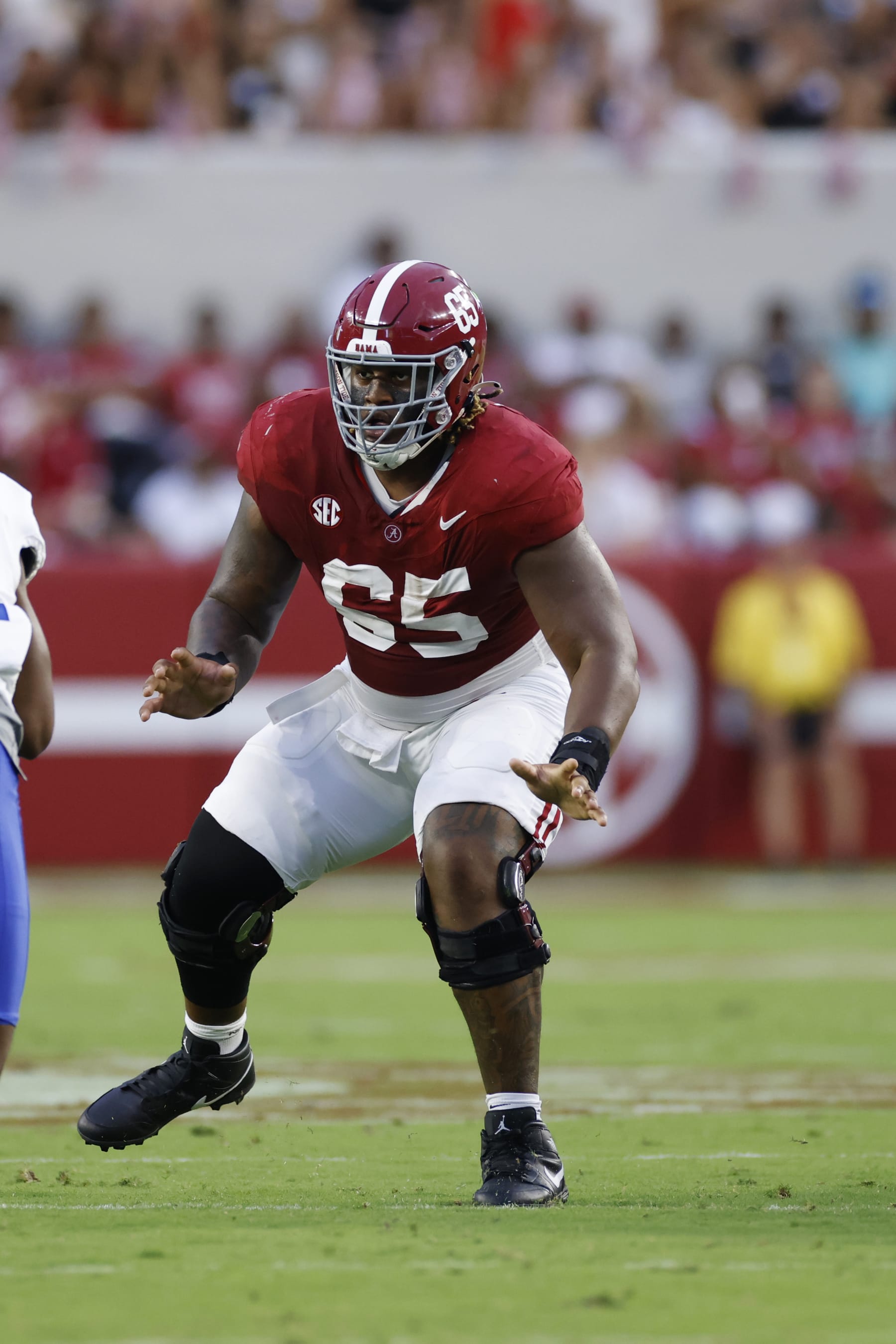 TUSCALOOSA, AL - SEPTEMBER 02: Alabama Crimson Tide offensive lineman JC Latham (65) blocks during a college football game against the Middle Tennessee Blue Raiders on September 02, 2023 at Bryant-Denny Stadium in Tuscaloosa, Alabama. (Photo by Joe Robbins/Icon Sportswire via Getty Images)