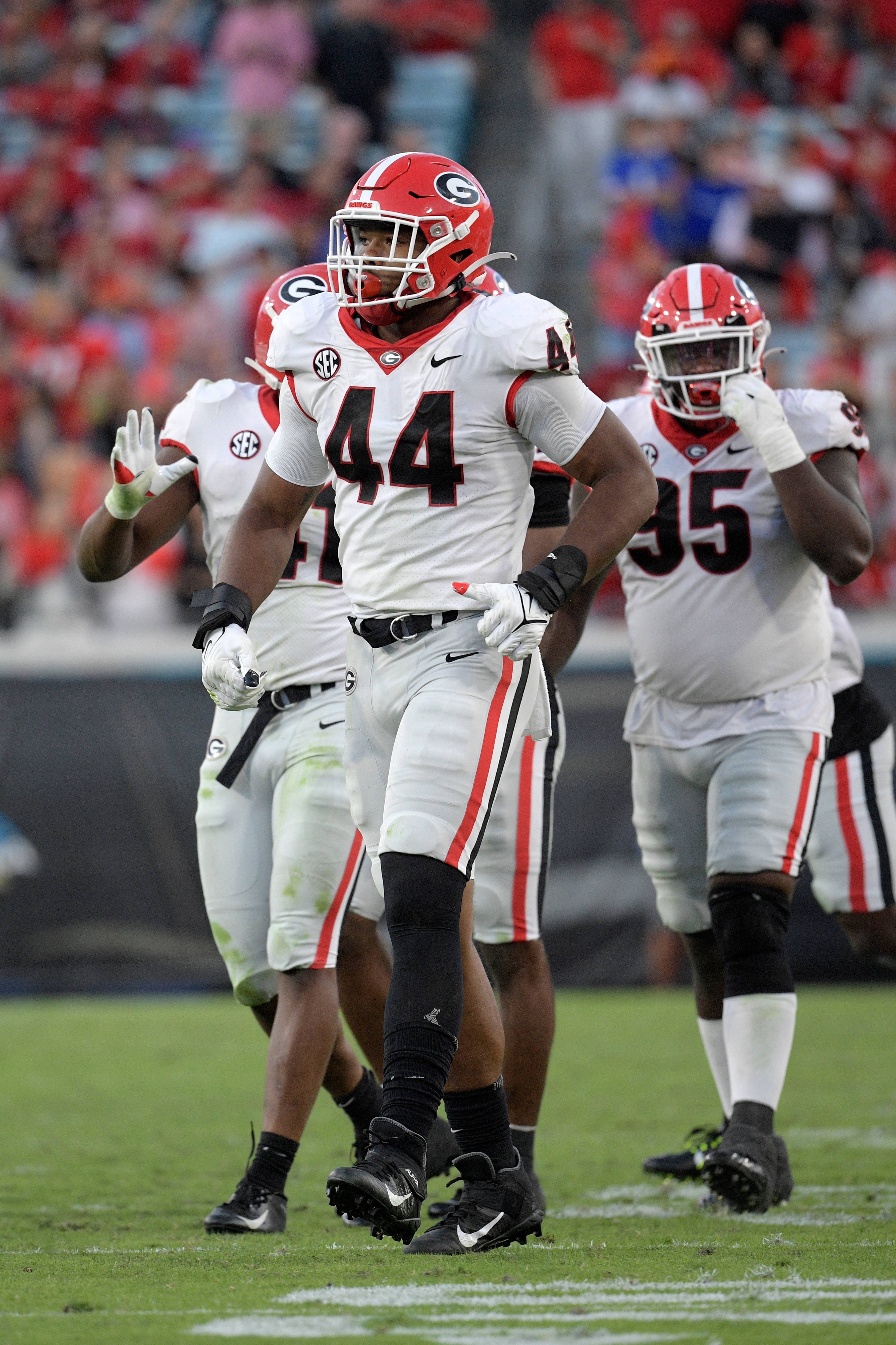 Georgia defensive lineman Travon Walker (44) and defensive lineman Devonte Wyatt (95) set up for a play during the second half of an NCAA college football game against Florida, Saturday, Oct. 30, 2021, in Jacksonville, Fla. (AP Photo/Phelan M. Ebenhack)